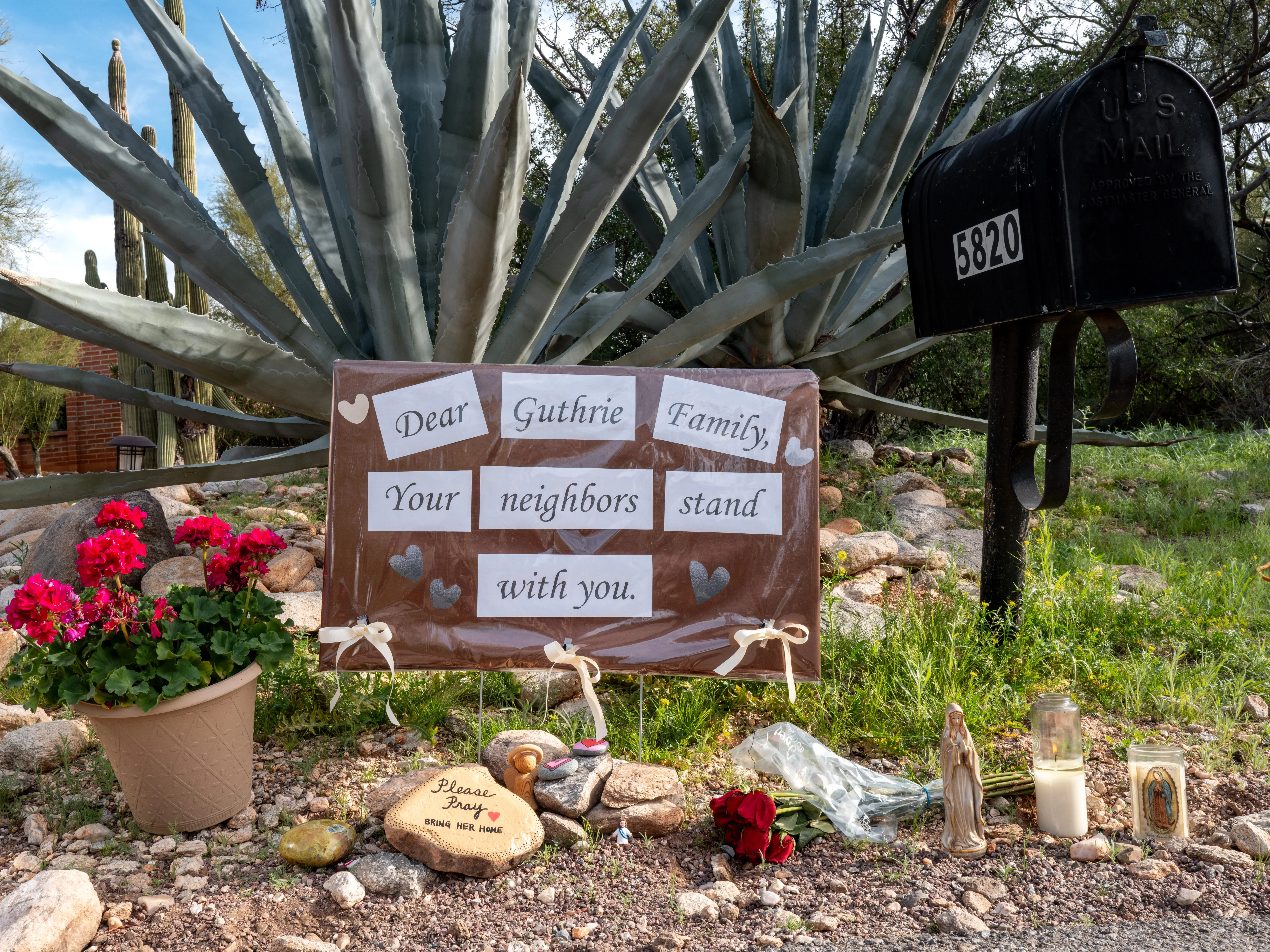 Sign left by neightbors outside of Nancy Guthrie's home in Tucson, Arizona
