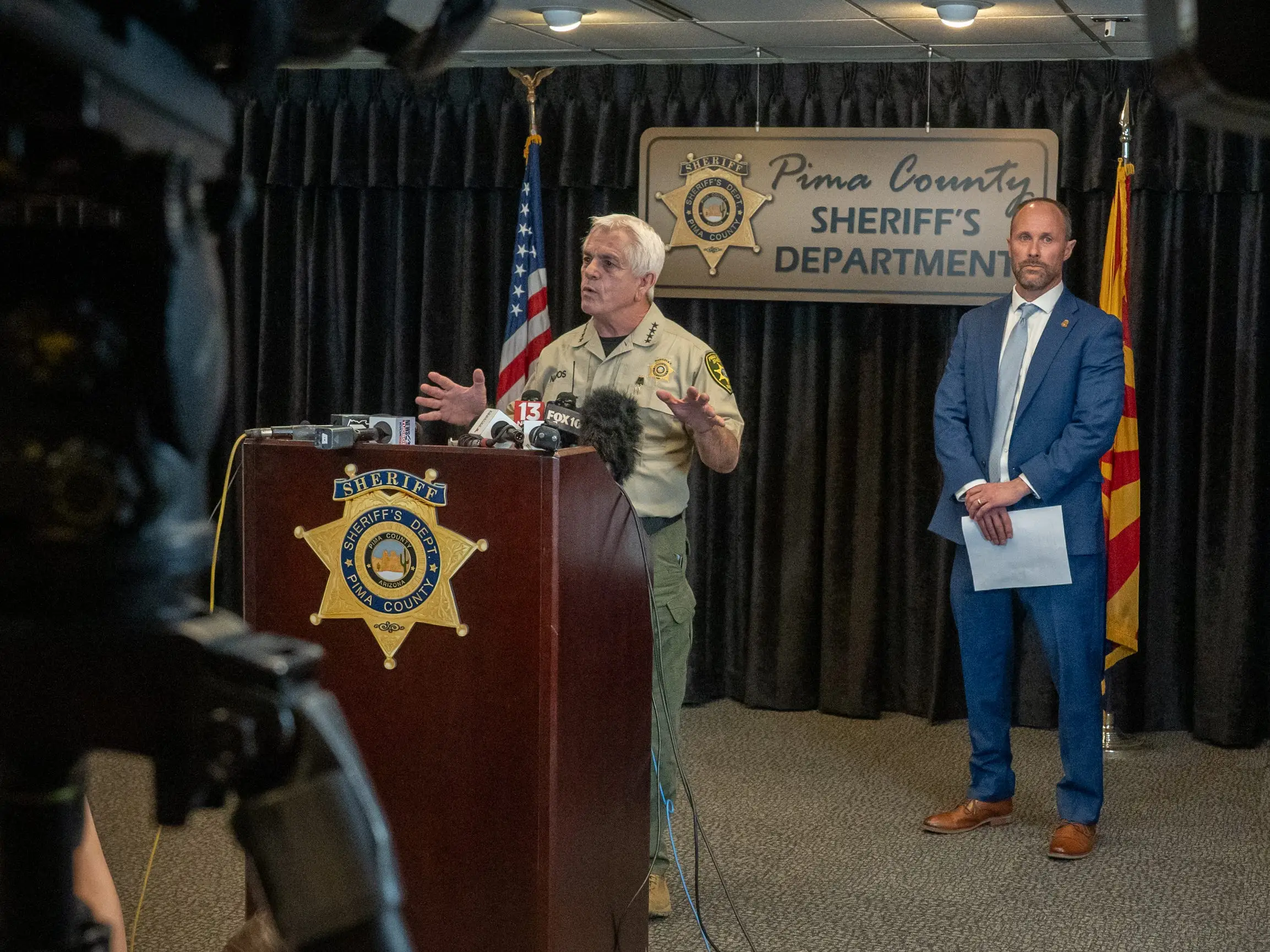 Pima County Sheriff, Chris Nanos (left), speaks to the media on February 3, 2026 in Tucson, Arizona. He and FBI assistant special agent in-charge Jon Edwards (right) were answering questions about the search for Nancy Guthrie, the missing mother of NBC host Savannah Guthrie.
