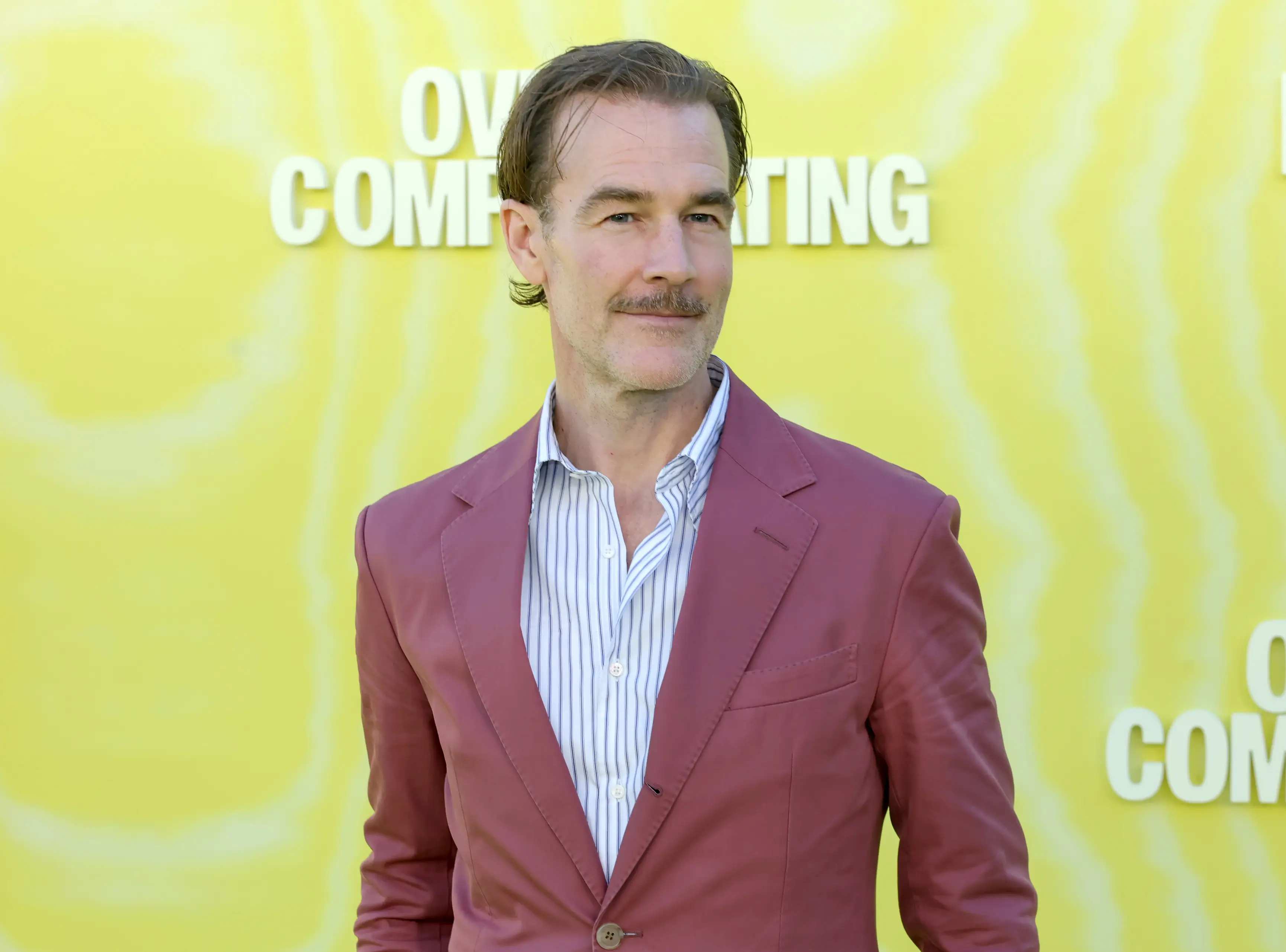 James Van der Beek in a magenta-colored suit