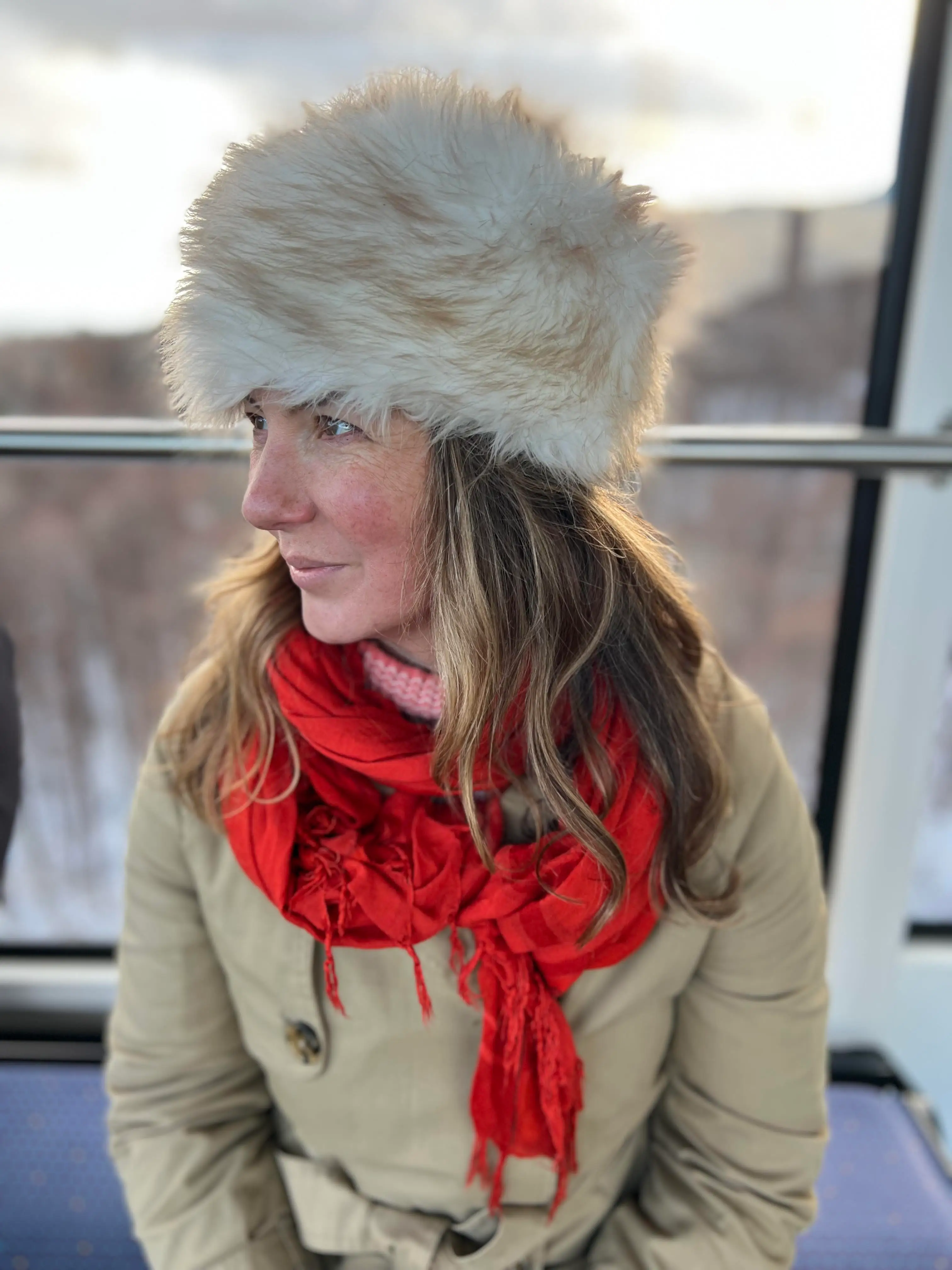 A woman wearing a fluffy hat in Hokkaido, Japan.
