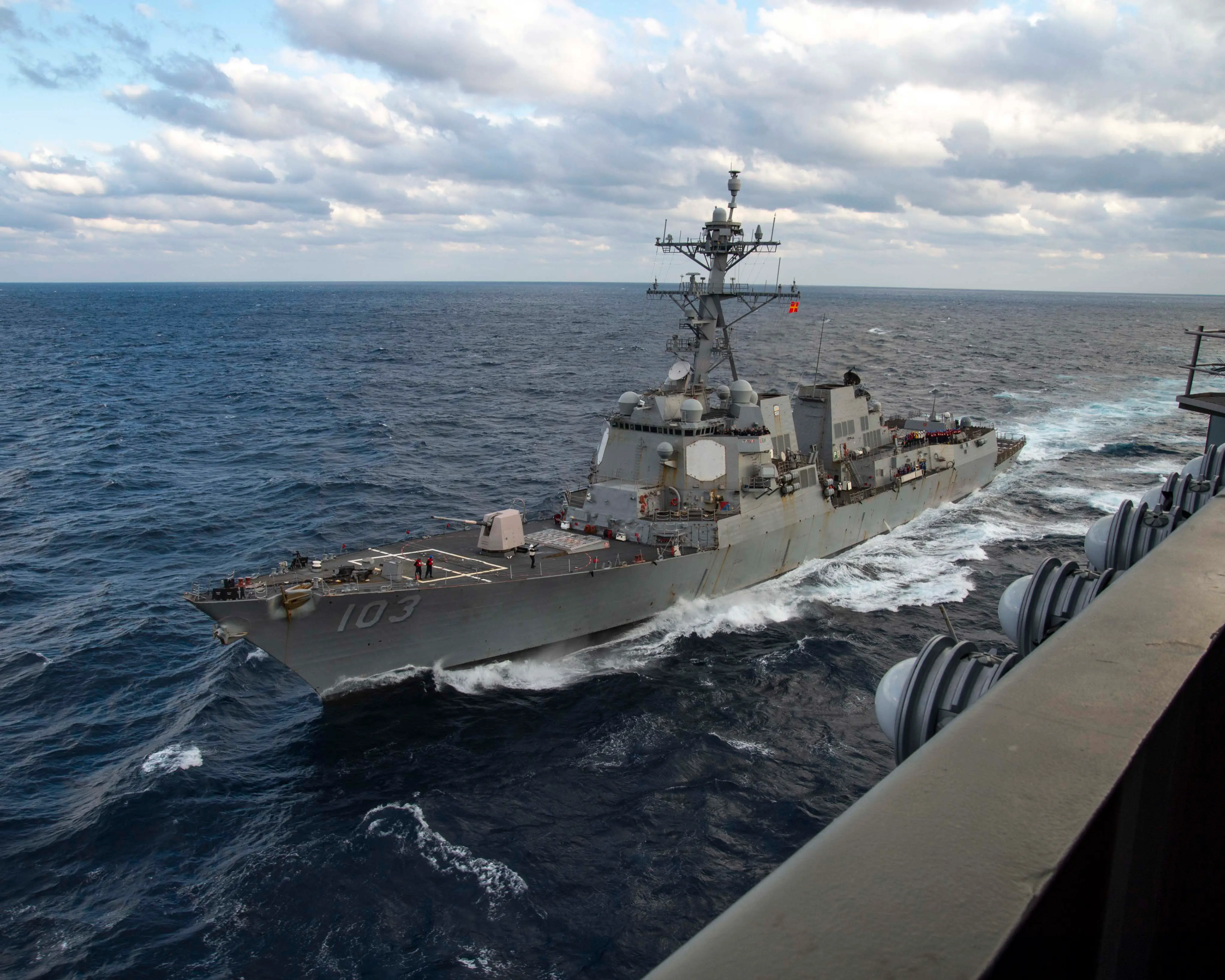 The Arleigh Burke-class guided-missile destroyer USS Truxtun sails alongside the Nimitz-class aircraft carrier USS George H.W. Bush (CVN 77) during a fueling-at-sea, Feb. 28.