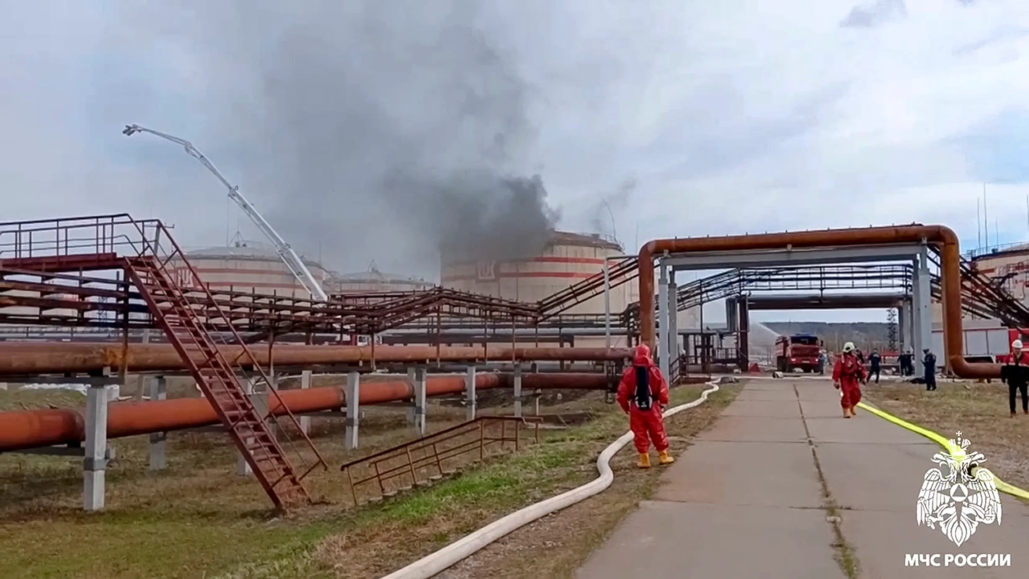In this photo, taken from a video released by the Russian Emergency Ministry Press Service on Sunday, June 2, 2024, firefighters work at the site of an oil refinery near the city of Ukhta, Komi Republic, Russia.