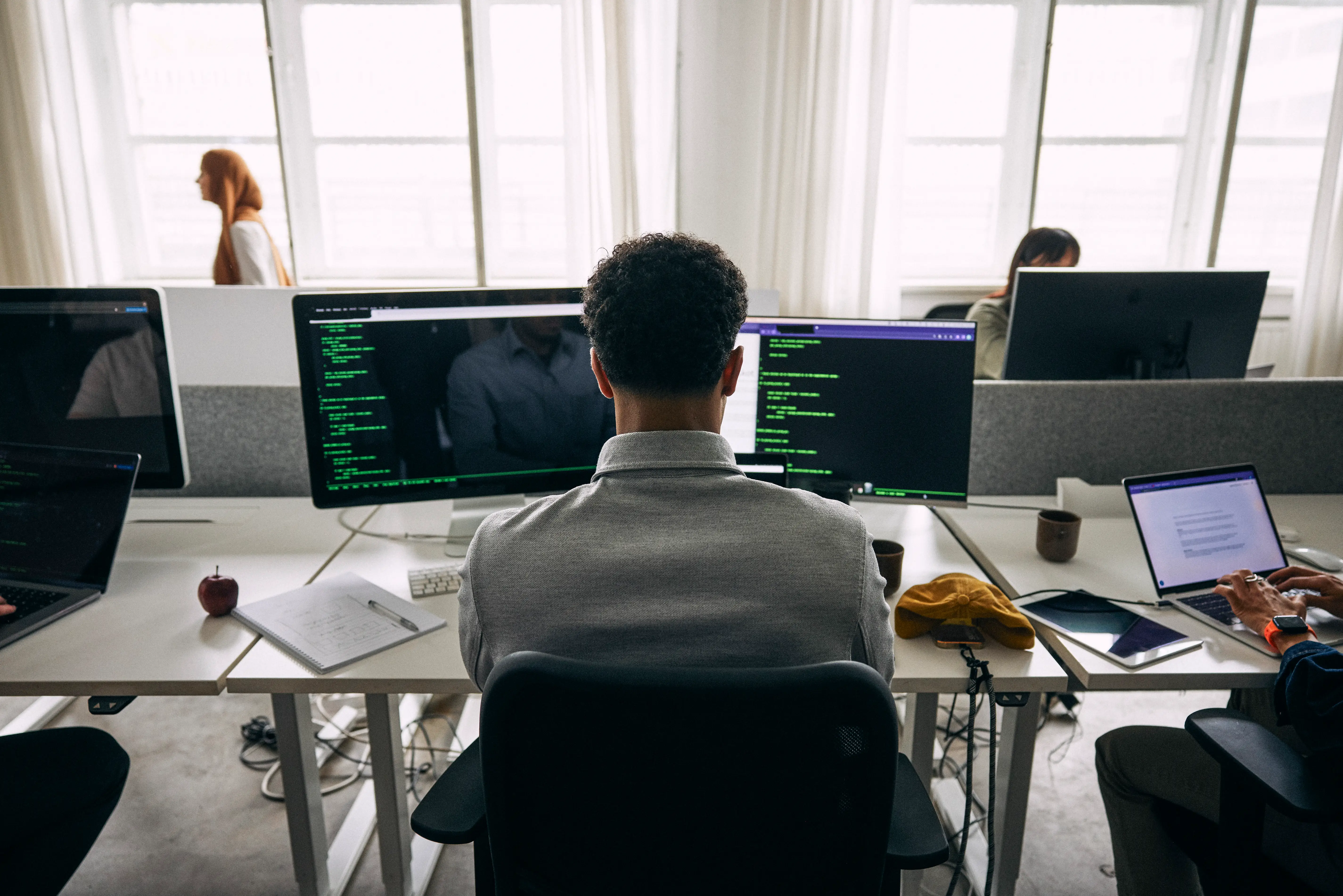 A software engineer doing some coding at work.