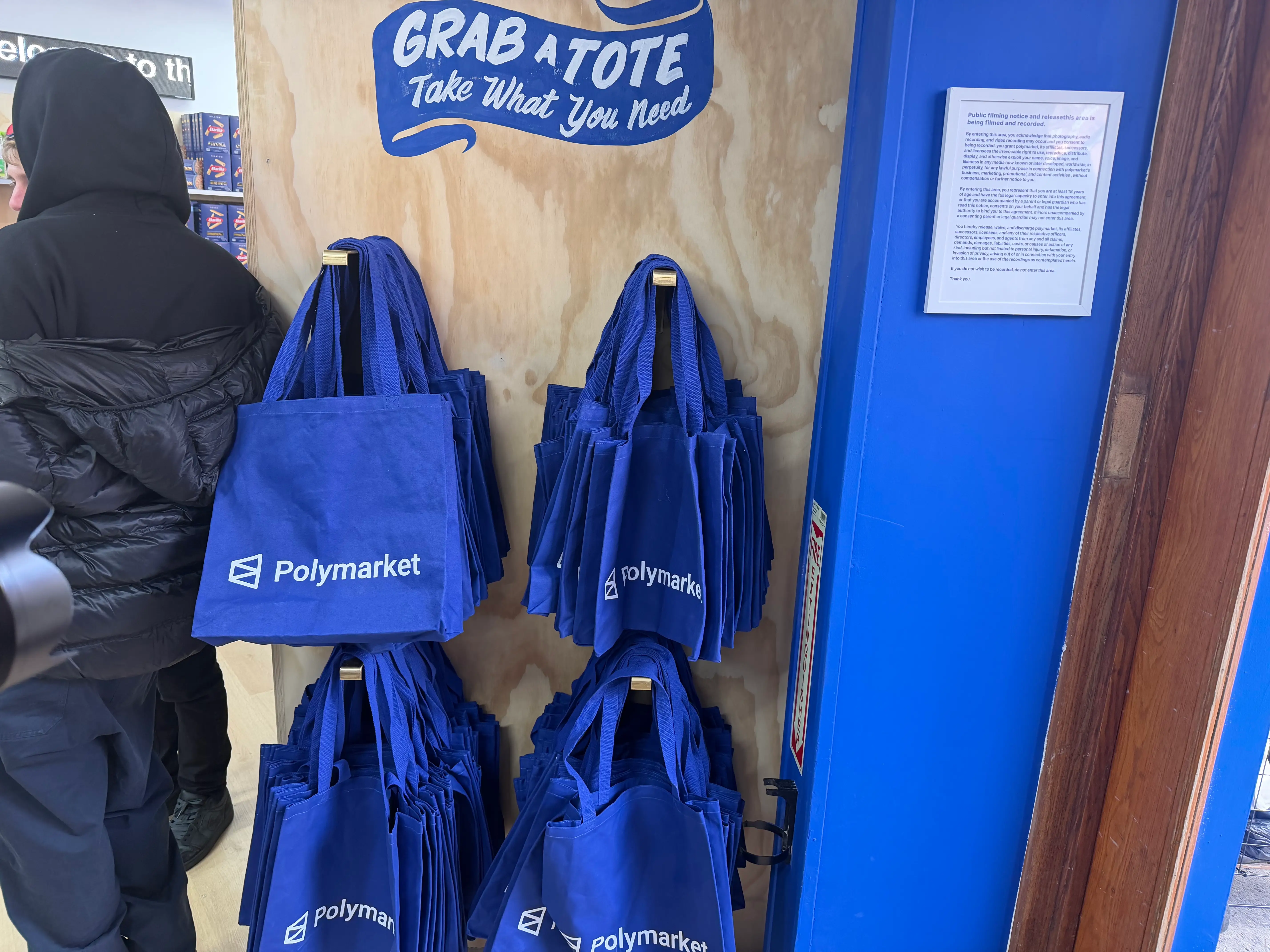 Free tote bags are pictured at the Polymarket.