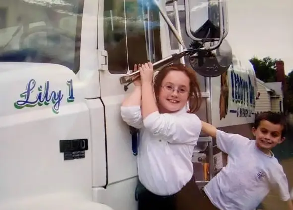 Teddy Rainville and sister as kids hanging off a truck