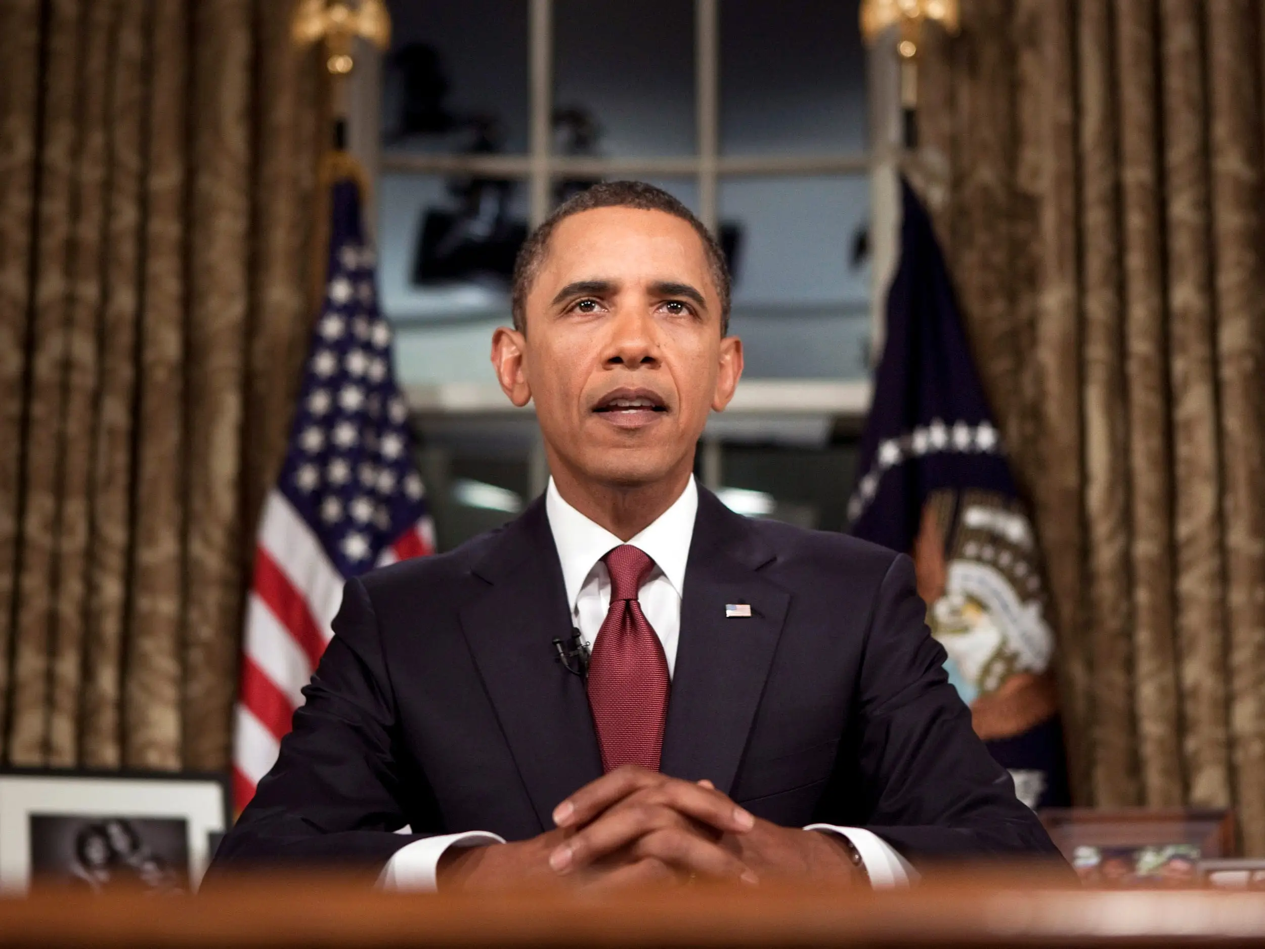 President Barack Obama adresses the nation from the Oval Office in the WHite House during his Presidency