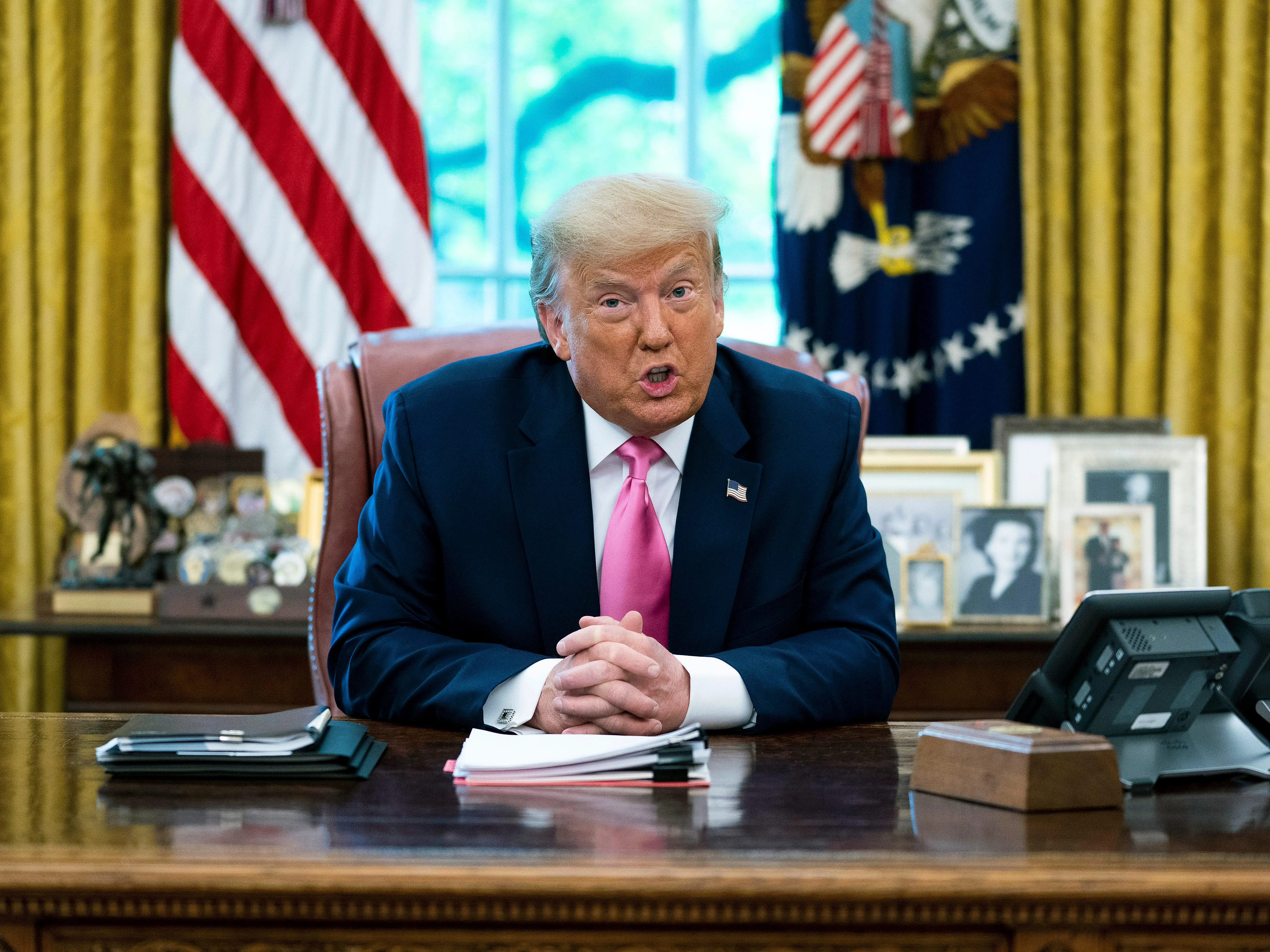 Donald Trump addresses reporters from the Oval Office during his second term.