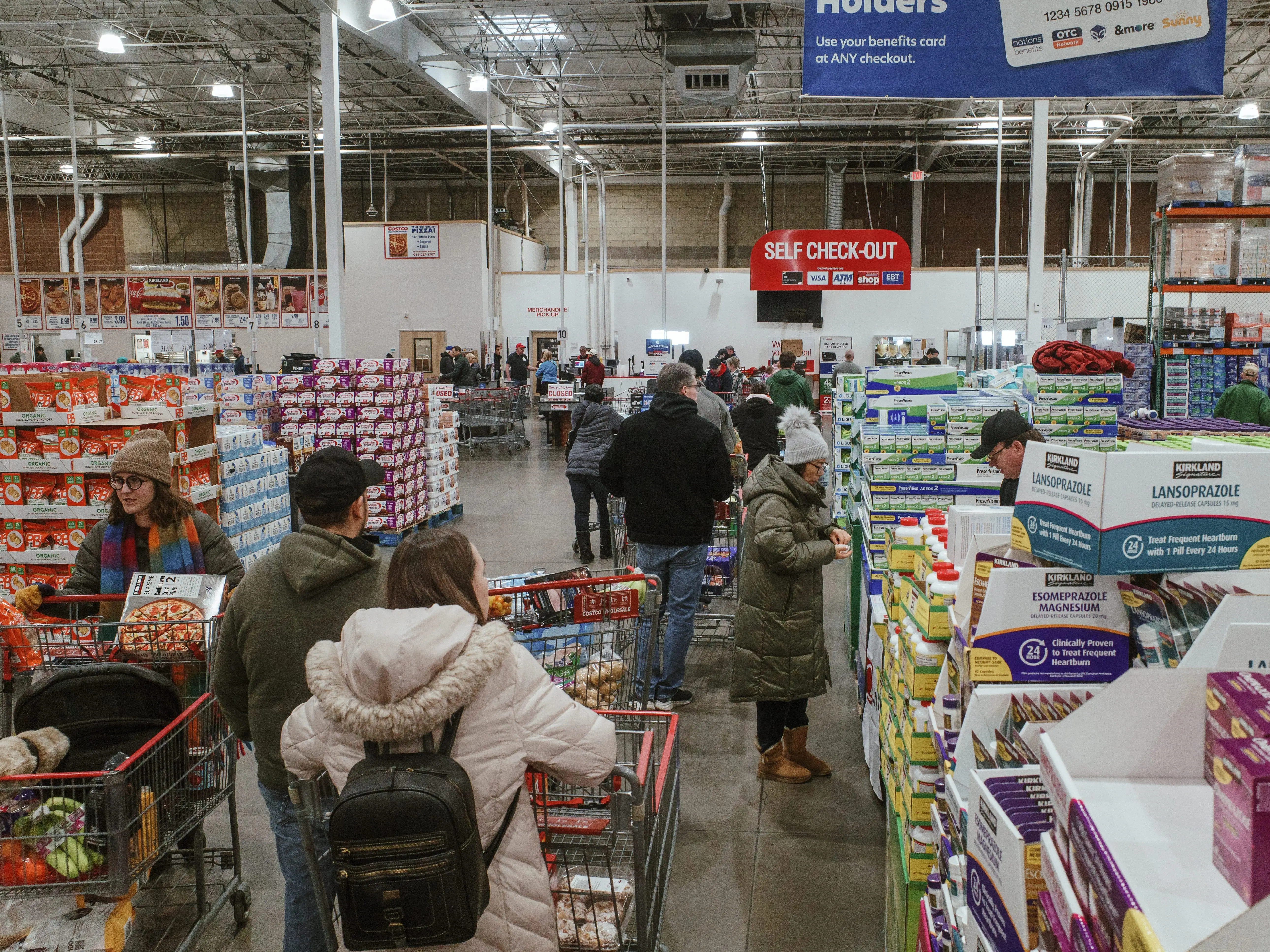 People with shopping carts at a store