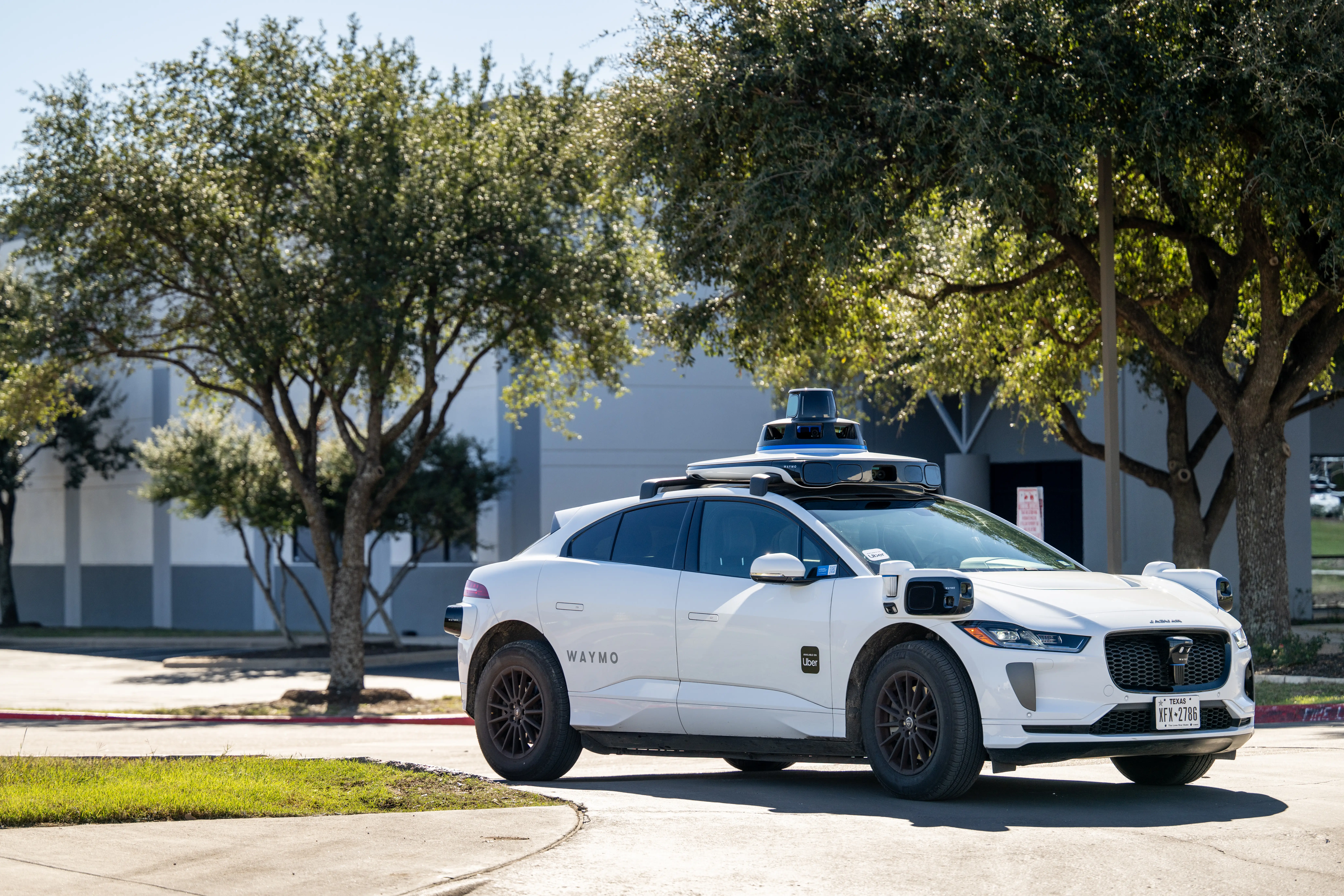 A Waymo vehicle exits a charging lot on January 15, 2026 in Austin, Texas.
