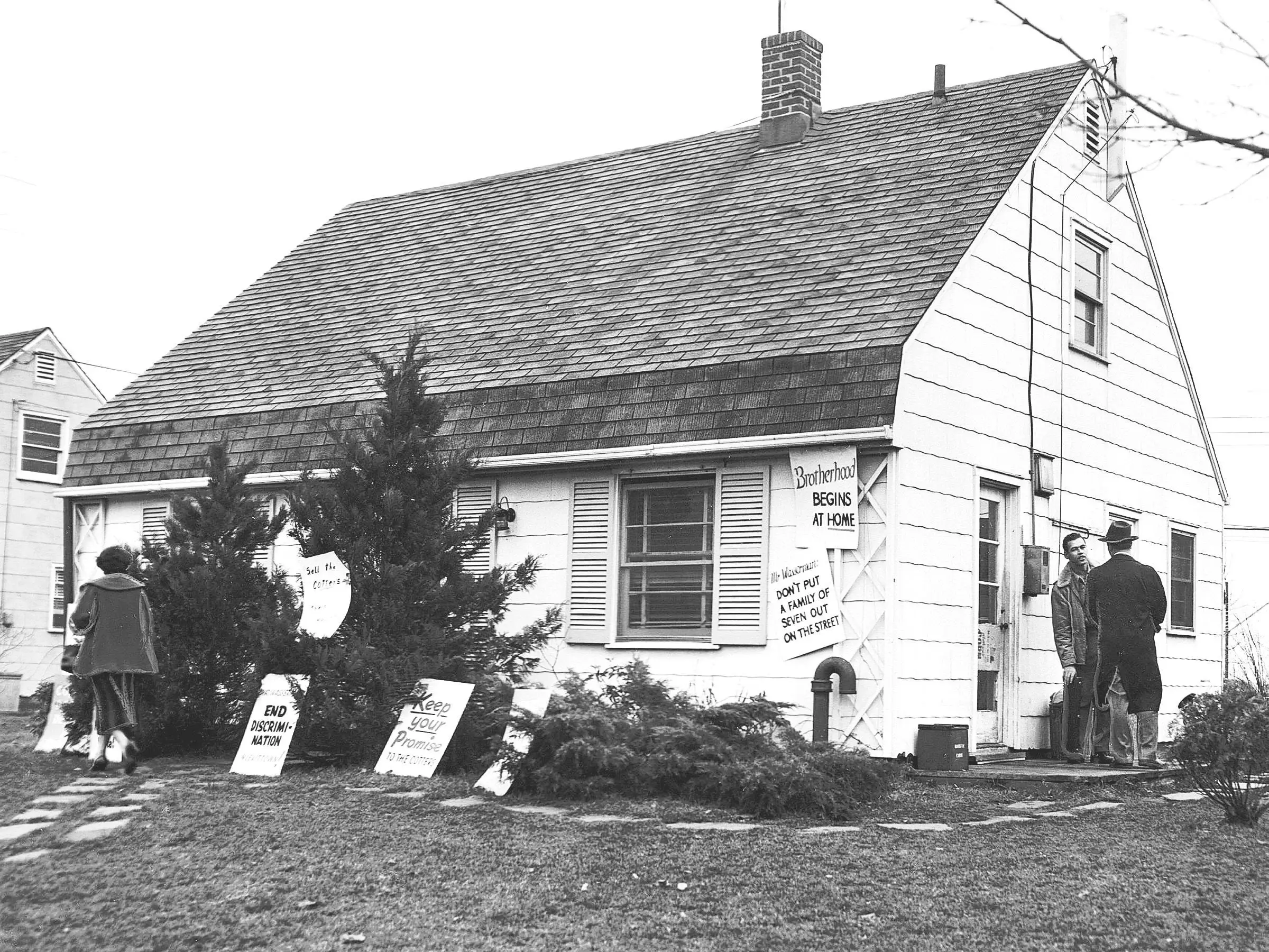 William Cotter's Levittown home, plastered with signs.