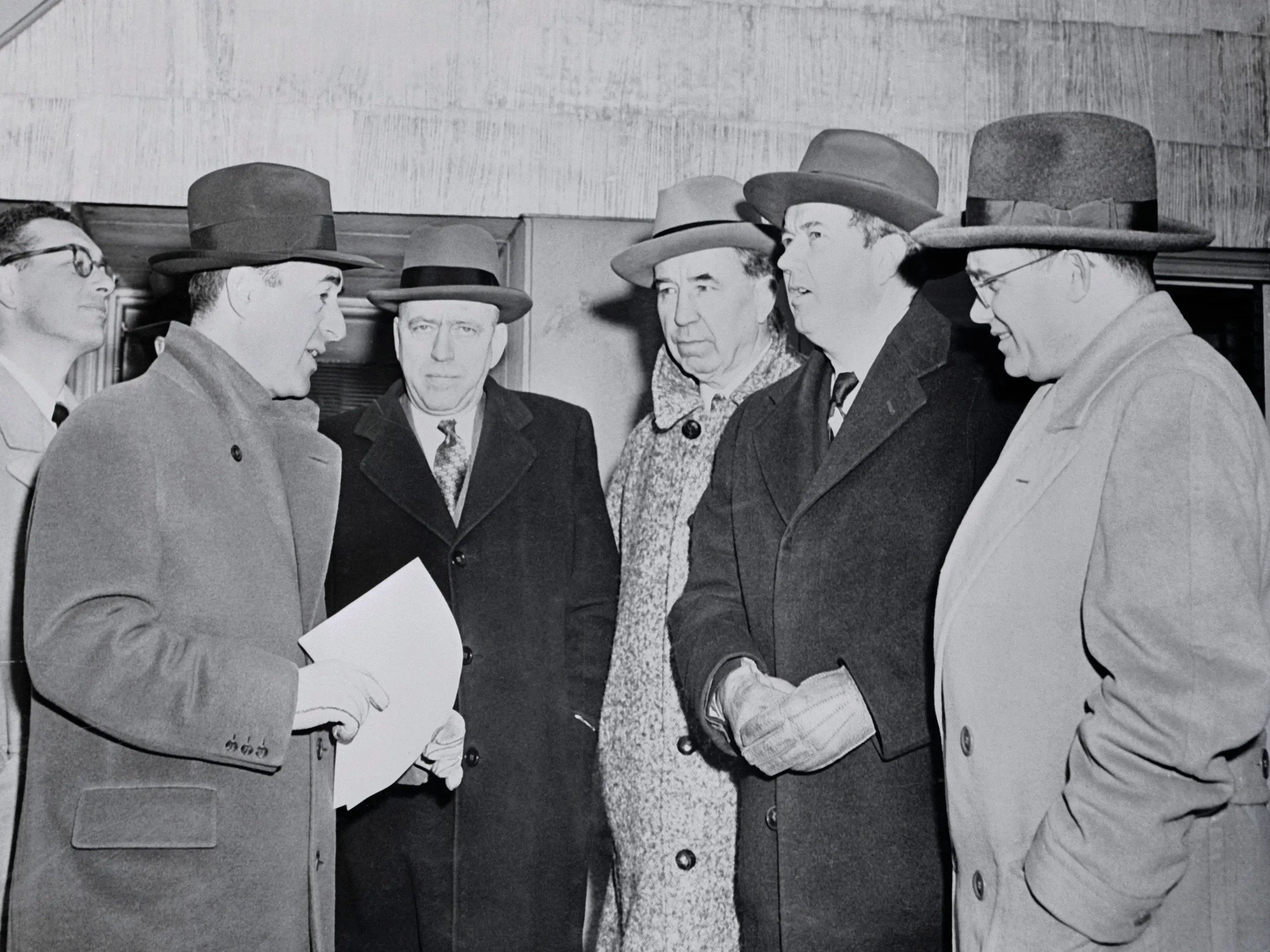 William J. Levitt speaks with three senators.