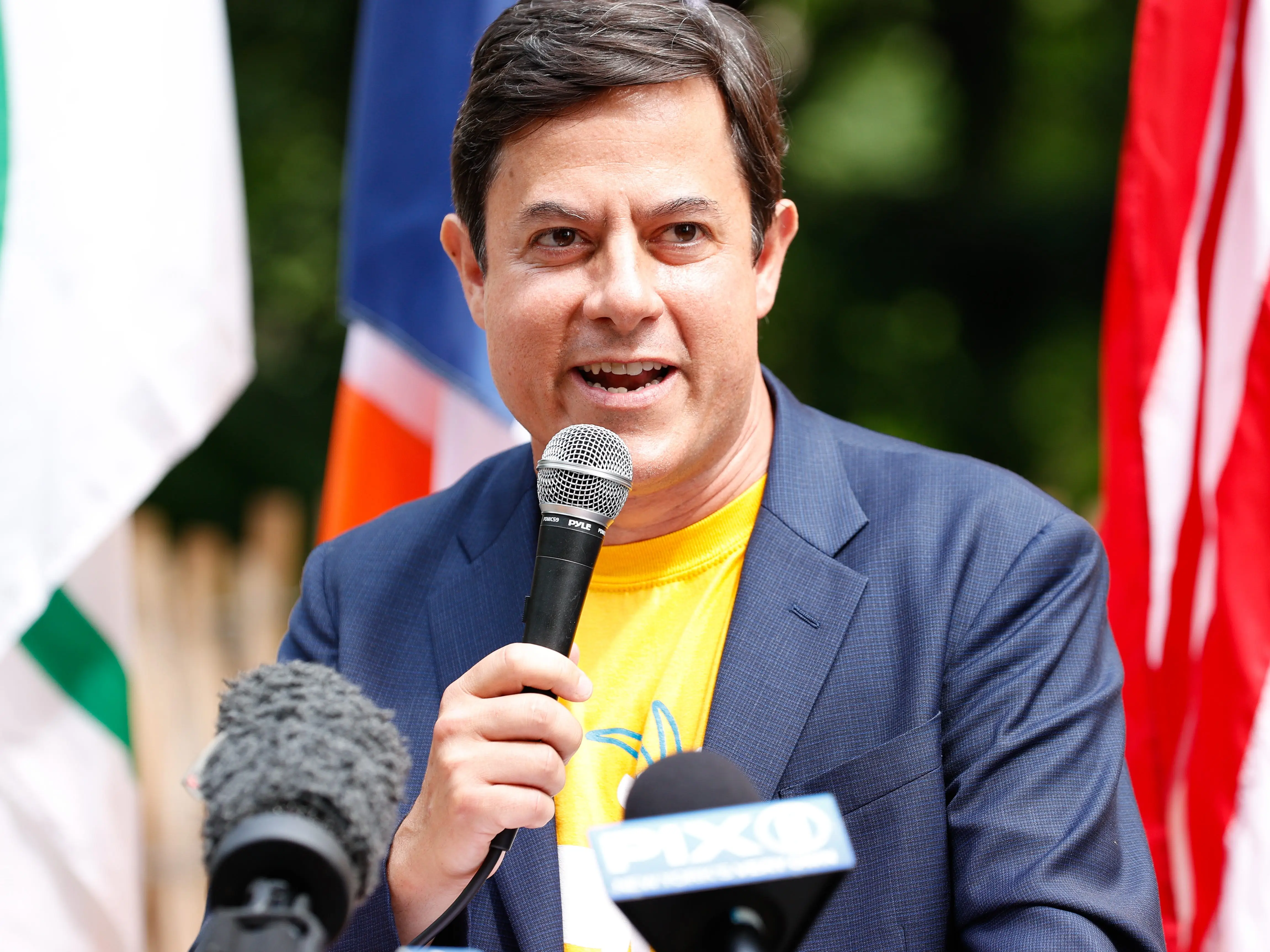 Director of the New York City Department of Planning, Dan Garodnick, speaking into a microphone.