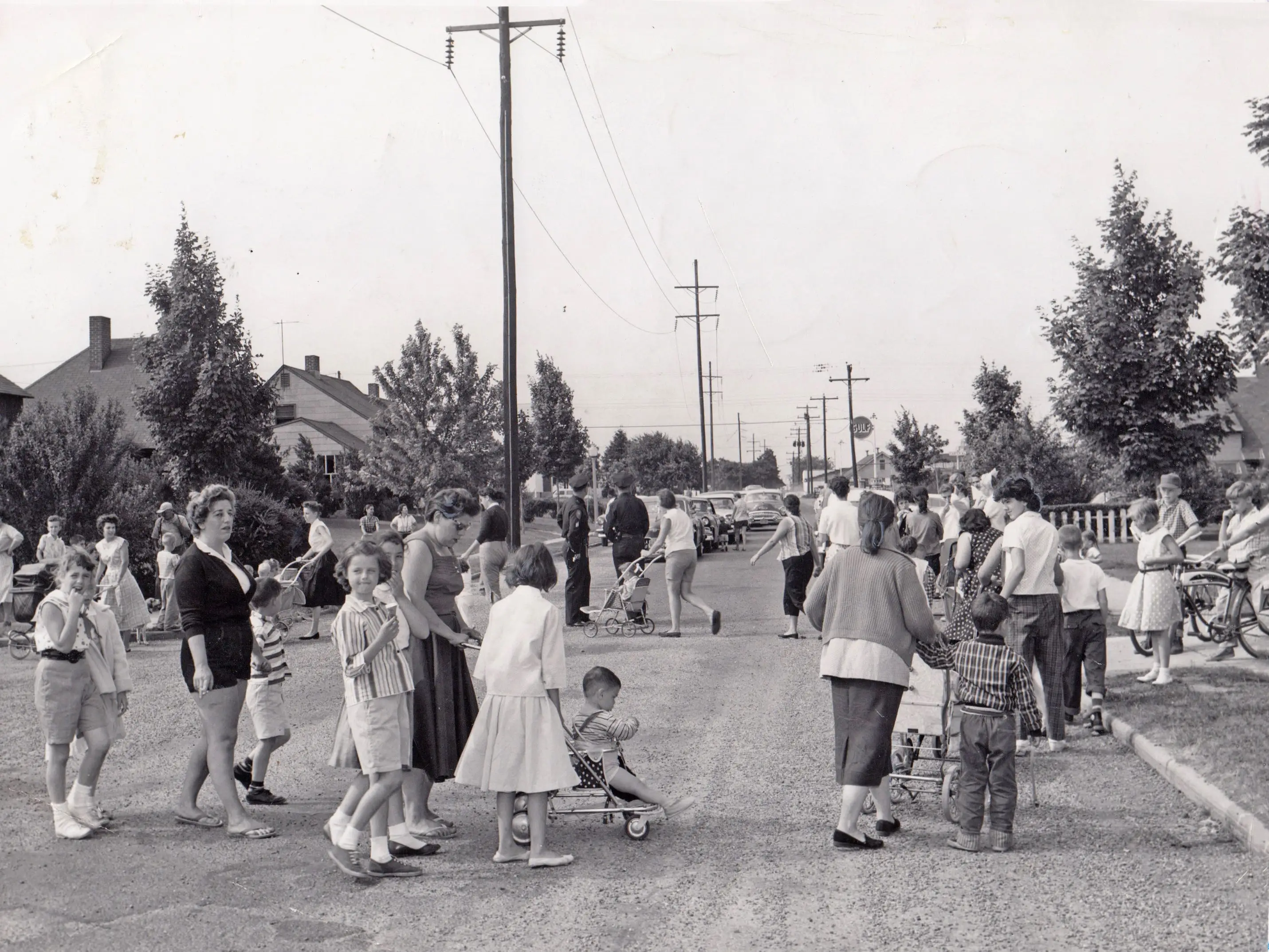 Women and children protest in favor of new stop signs.