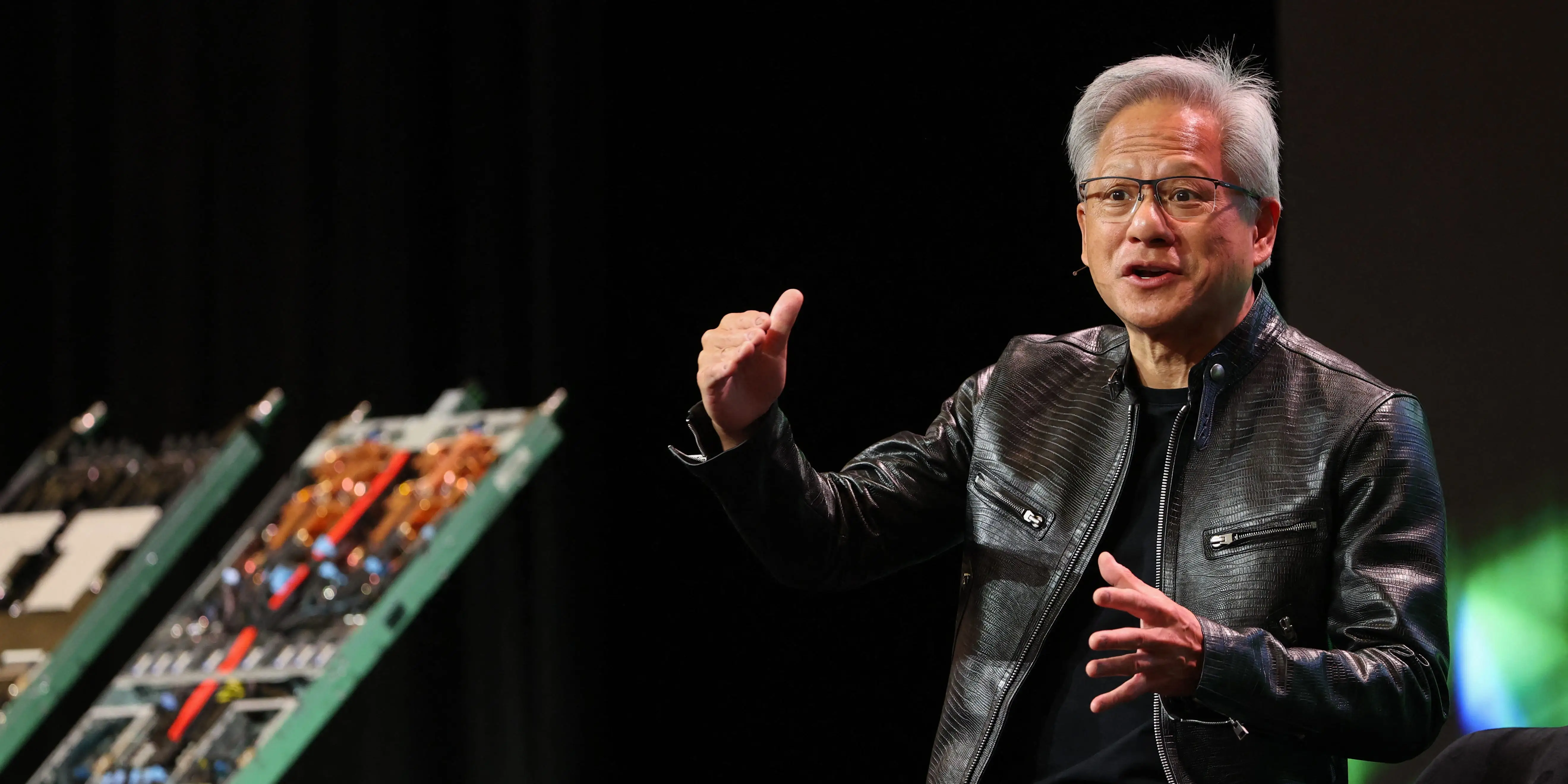 Nvidia CEO Jensen Huang on stage, talking.