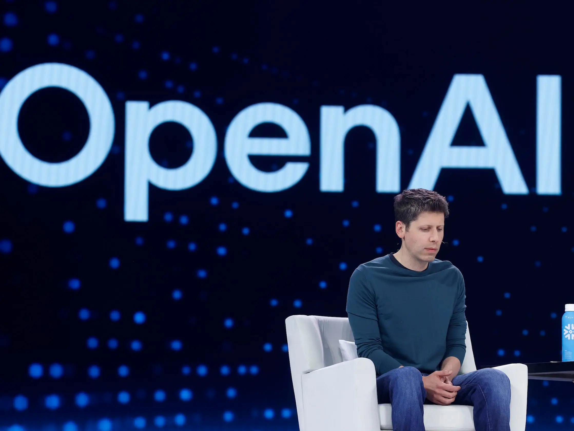 Sam Altman looks down during an OpenAI event