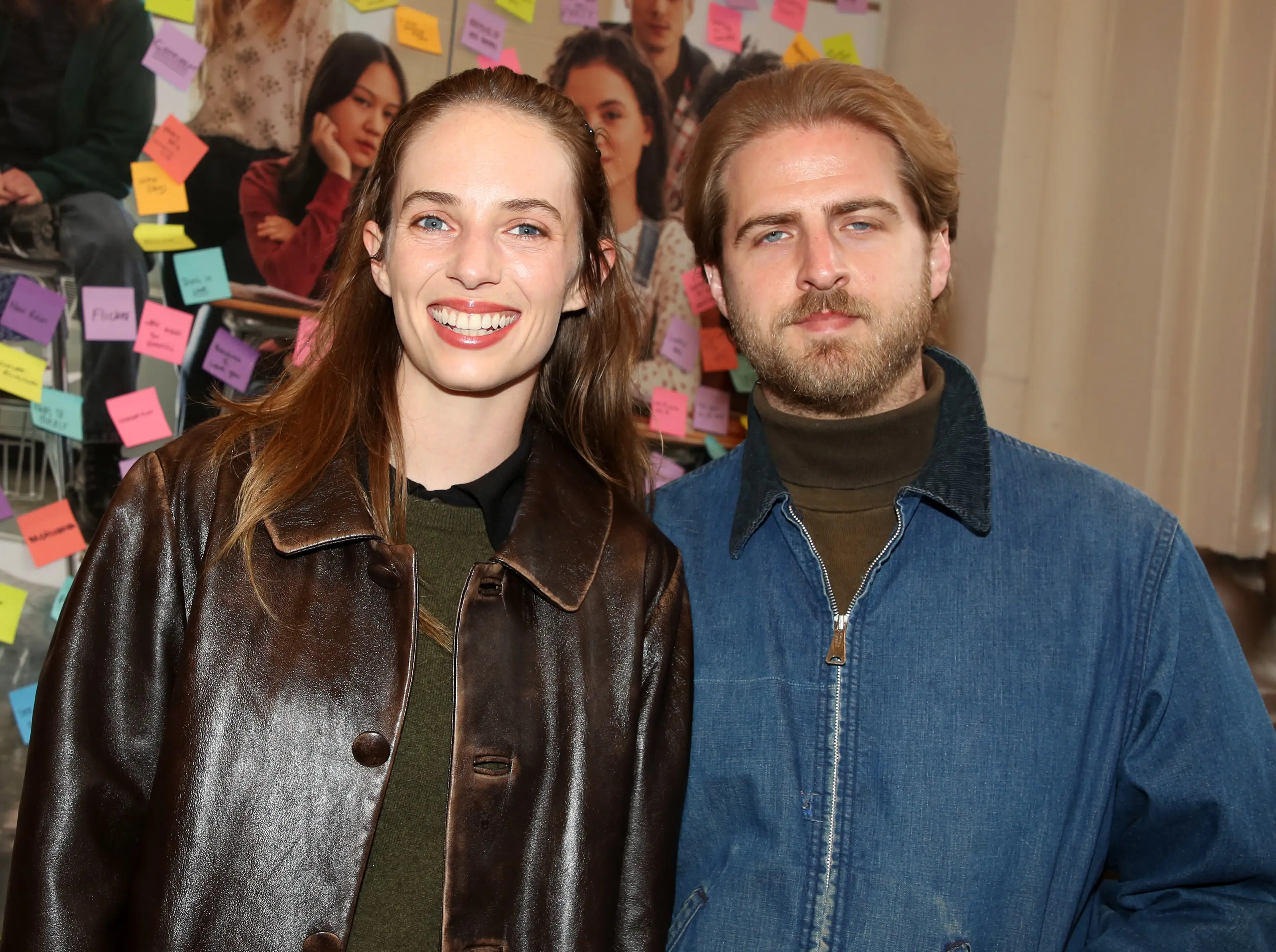 Maya Hawke and Christian Lee Hutson in jackets smiling