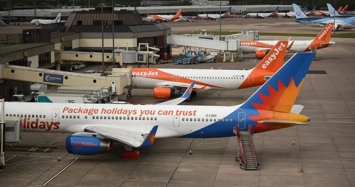 An airline barred 2 passengers after an in-flight brawl and plans to go after them for the cost of diverting the plane