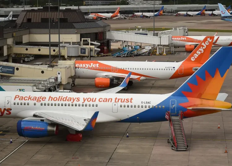 An airline barred 2 passengers after an in-flight brawl and plans to go after them for the cost of diverting the plane