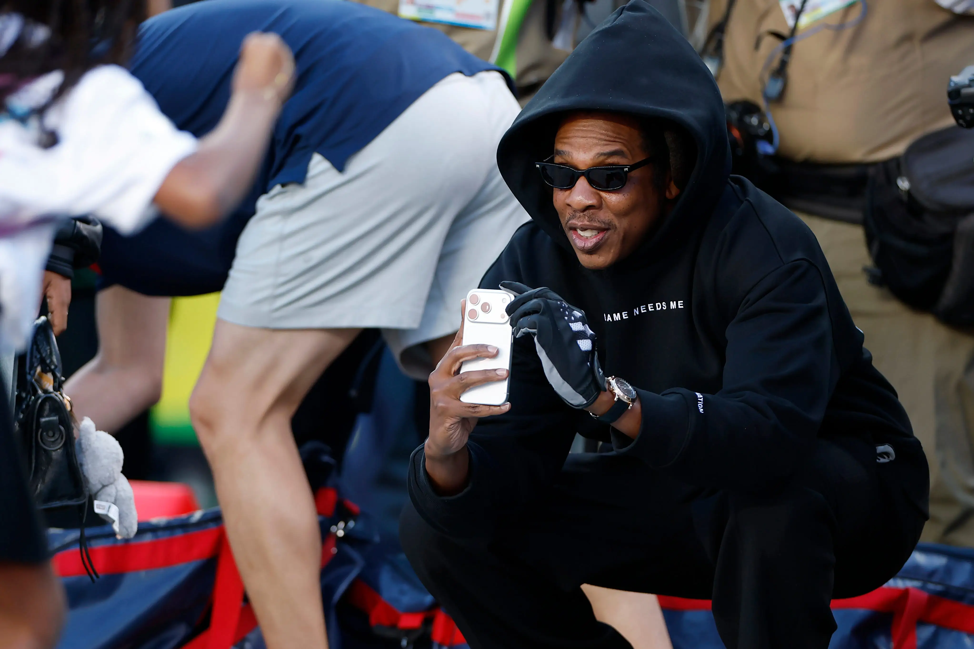 Jay-Z photographs his daughter at the 2026 Super Bowl.