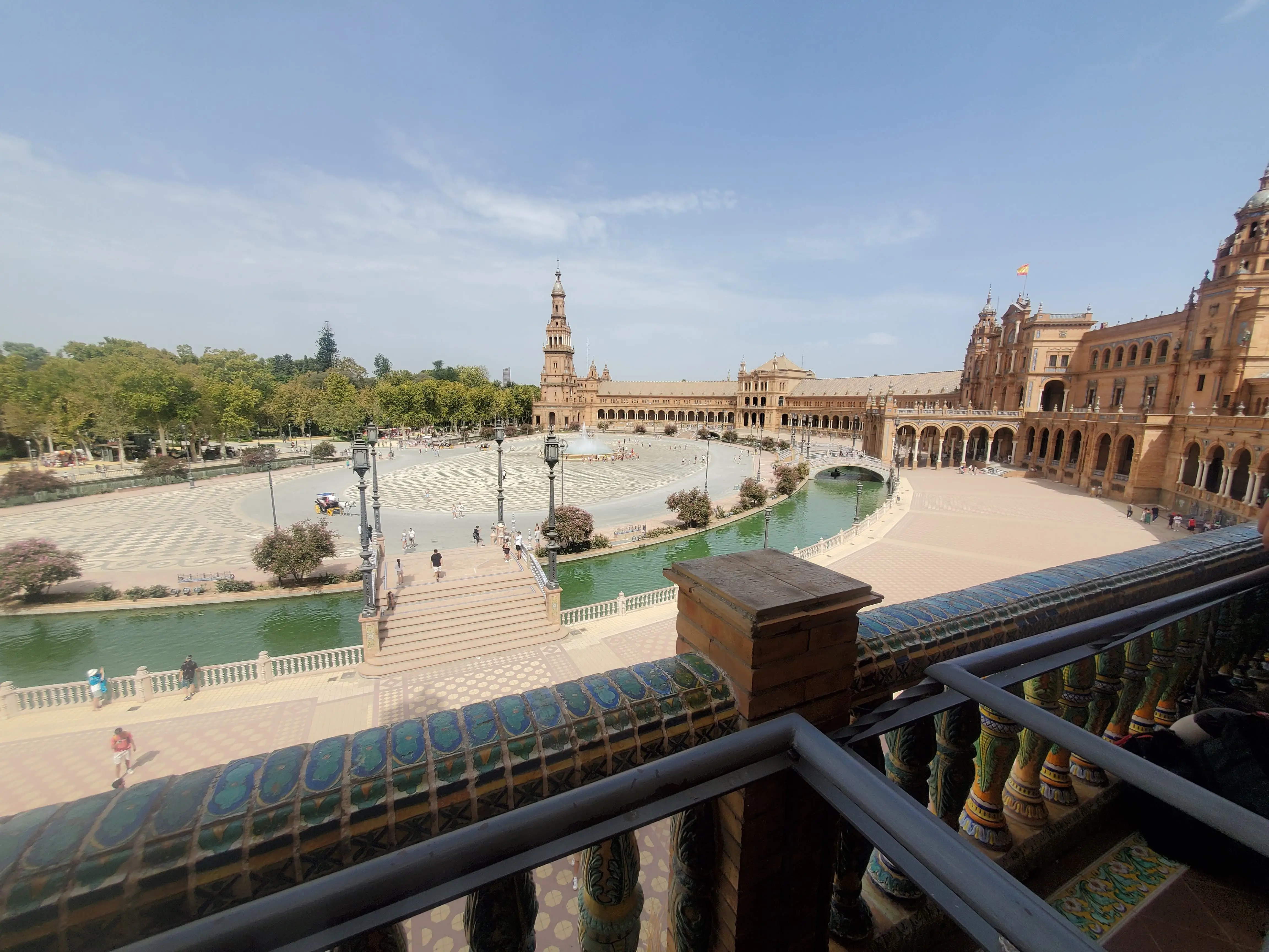 View of plaza with water around it from balcony