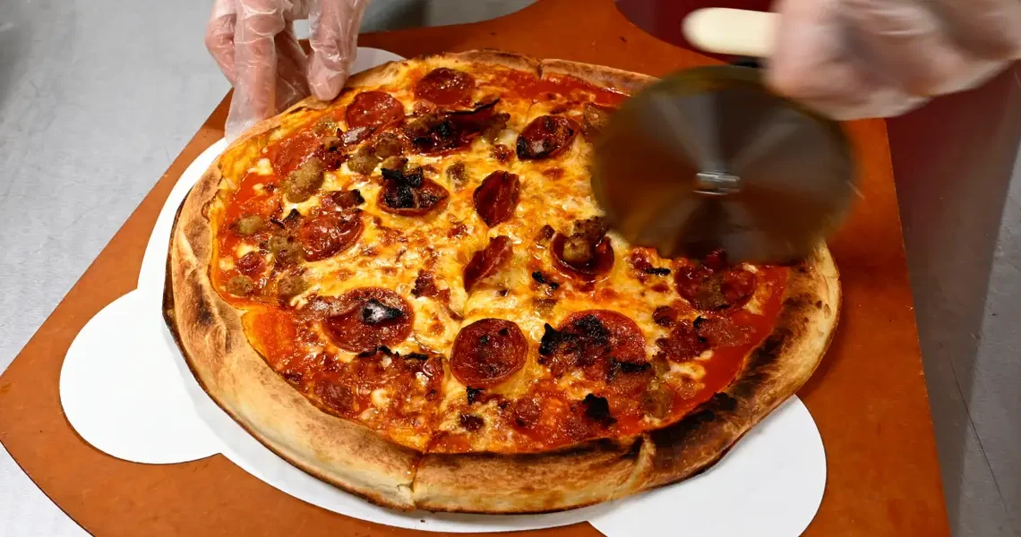 Elon Musk and OpenAI posture over pizza as the AI talent war heats up