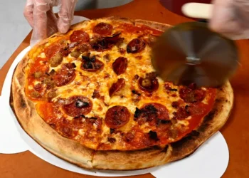 Elon Musk and OpenAI posture over pizza as the AI talent war heats up