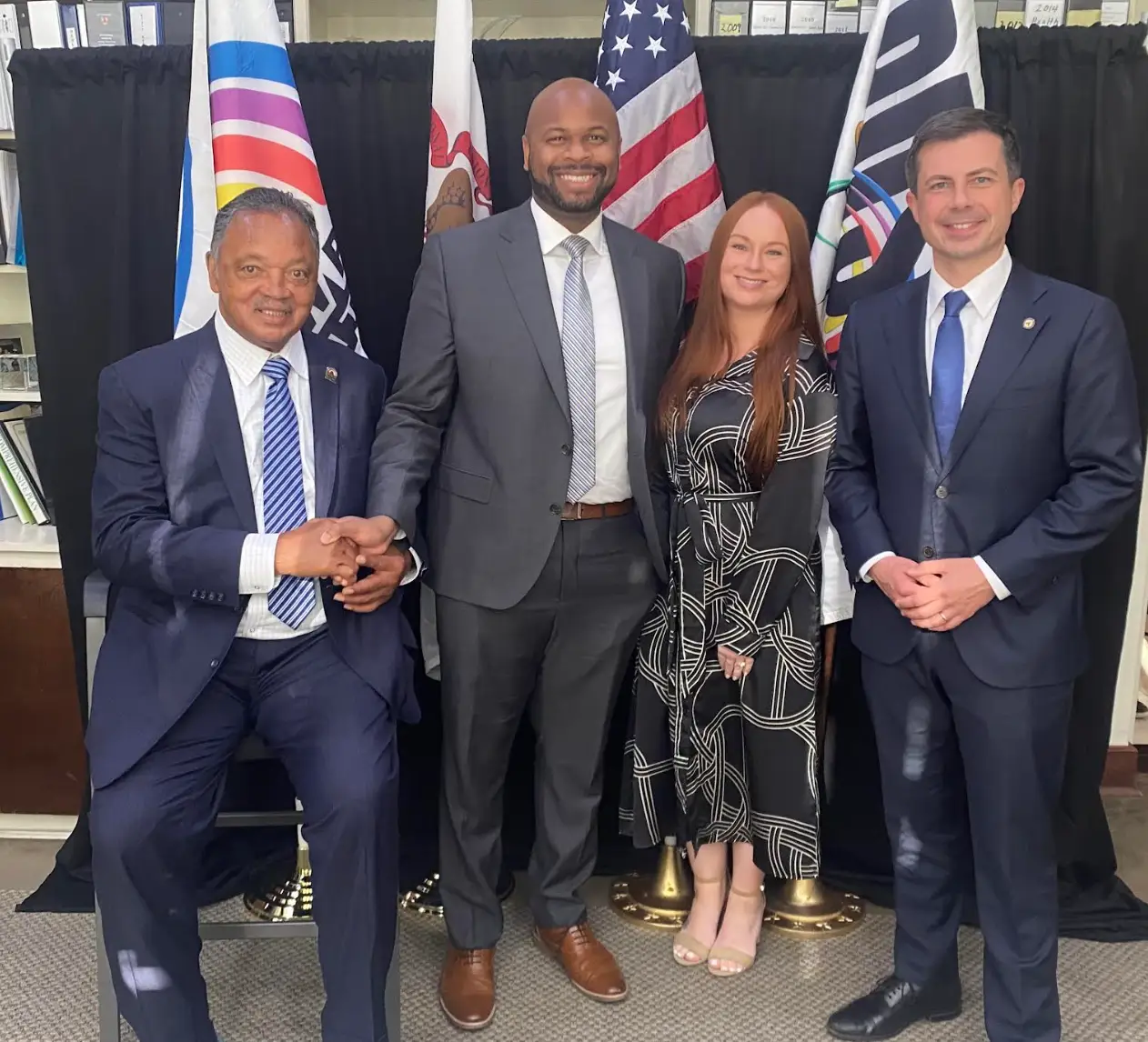 Rev. Jesse Jackson, Bradley Akubuiro and his wife, Allison England, and Pete Buttigieg at the Rainbow PUSH Coalition.