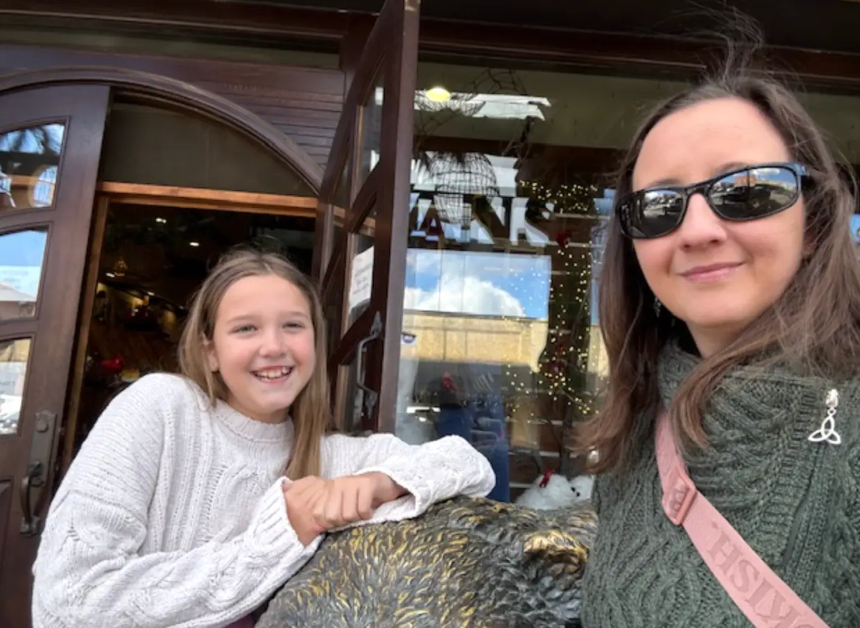 The writer posing with her daughter at a restaurant in Bryson City, North Carolina.