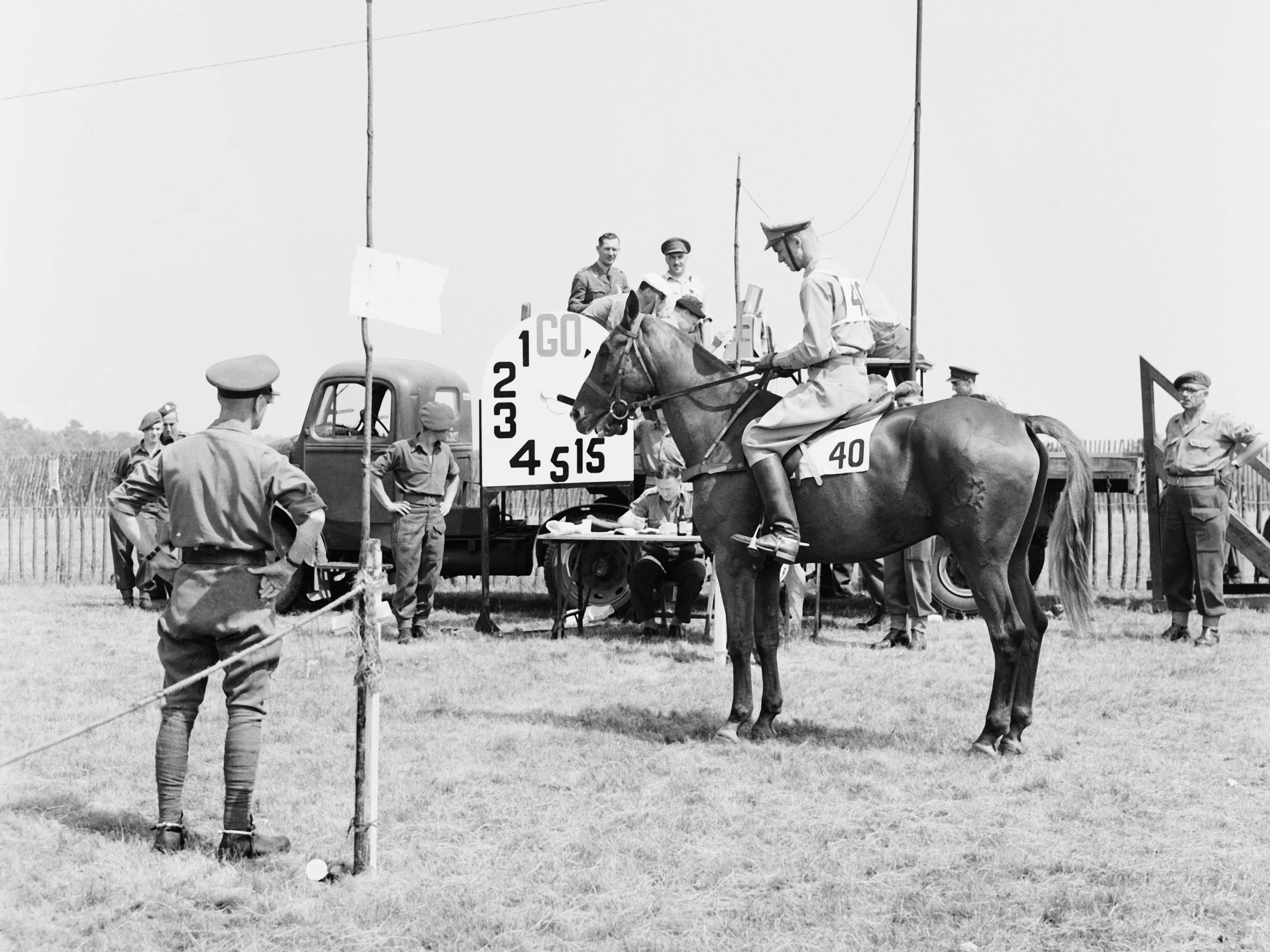 American athlete Richard Gruenther on his horse at the start of the 5000 metre point-to-point event in the modern pentathlon, during the Olympic Games, 30th July 1948. The event is being held at Tweseldown Racecourse, near Aldershot, Hampshire.
