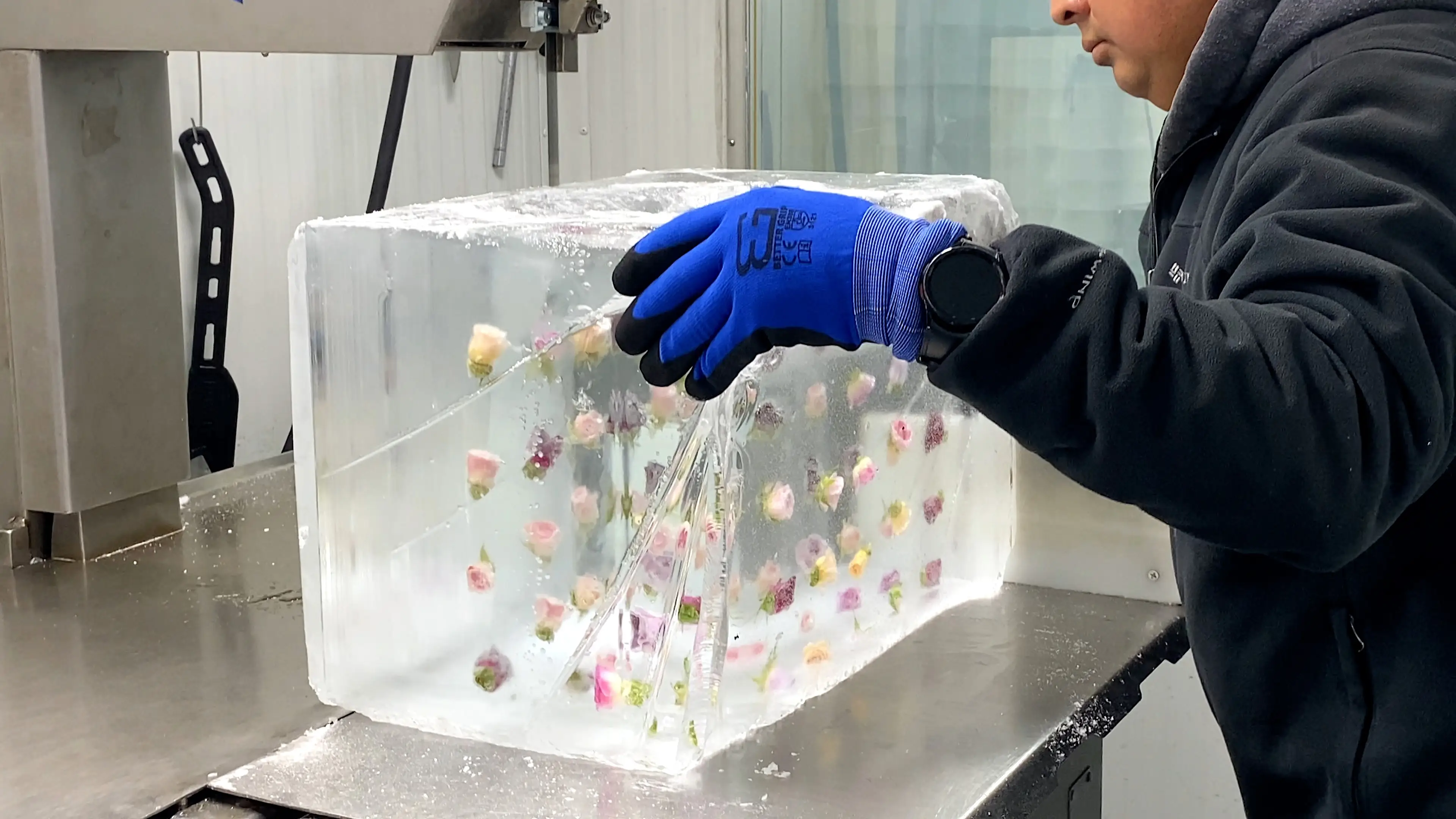 Large block of ice with flowers embedded inside.