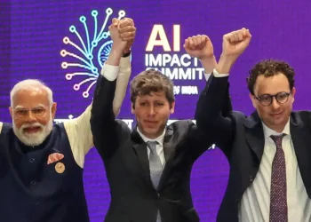 AI’s top leaders got corralled into holding hands. It made for a photo op for the ages.