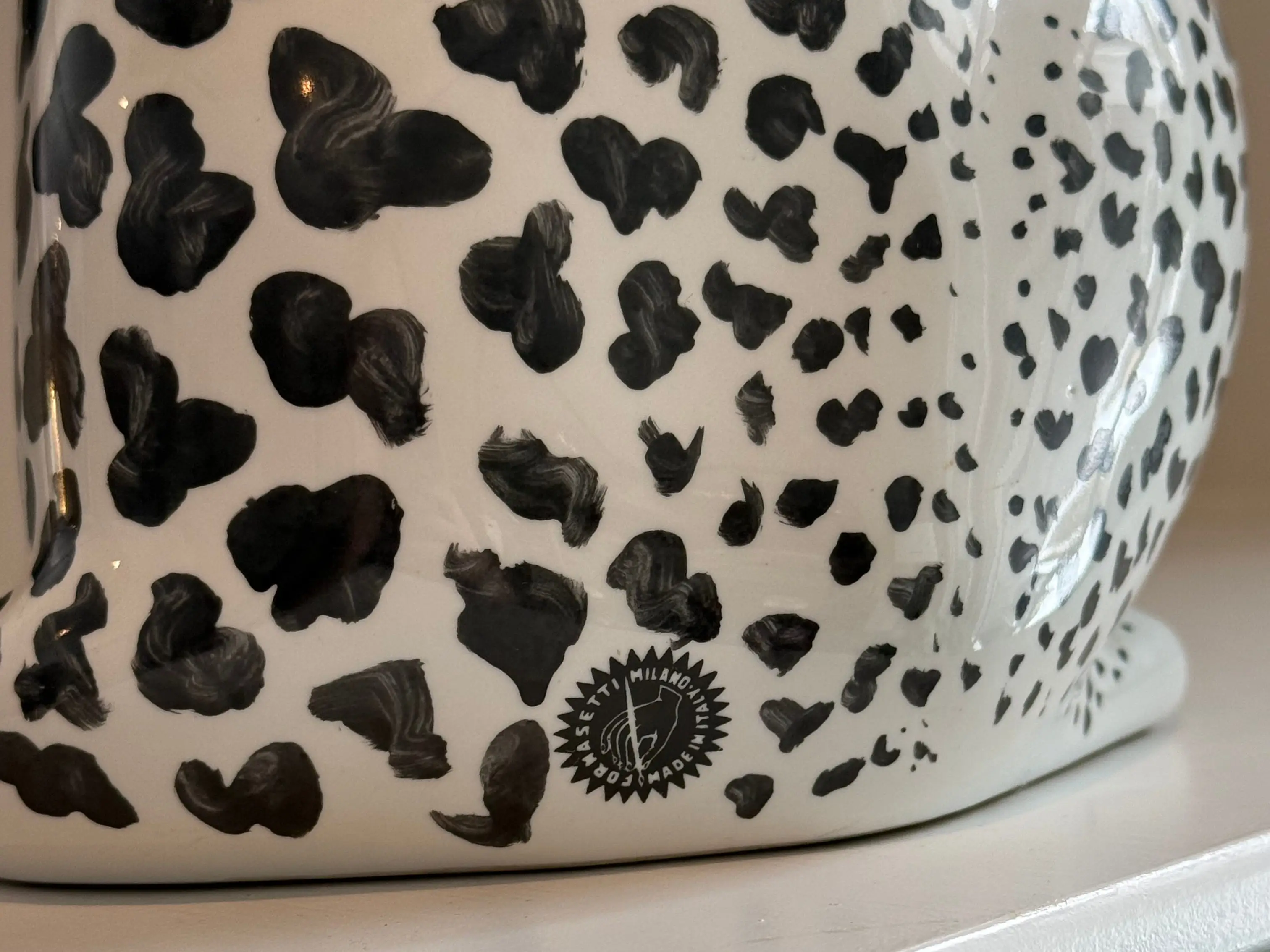 The Fornasetti stamp on the ceramic cat purchased by Jordan Piluso.