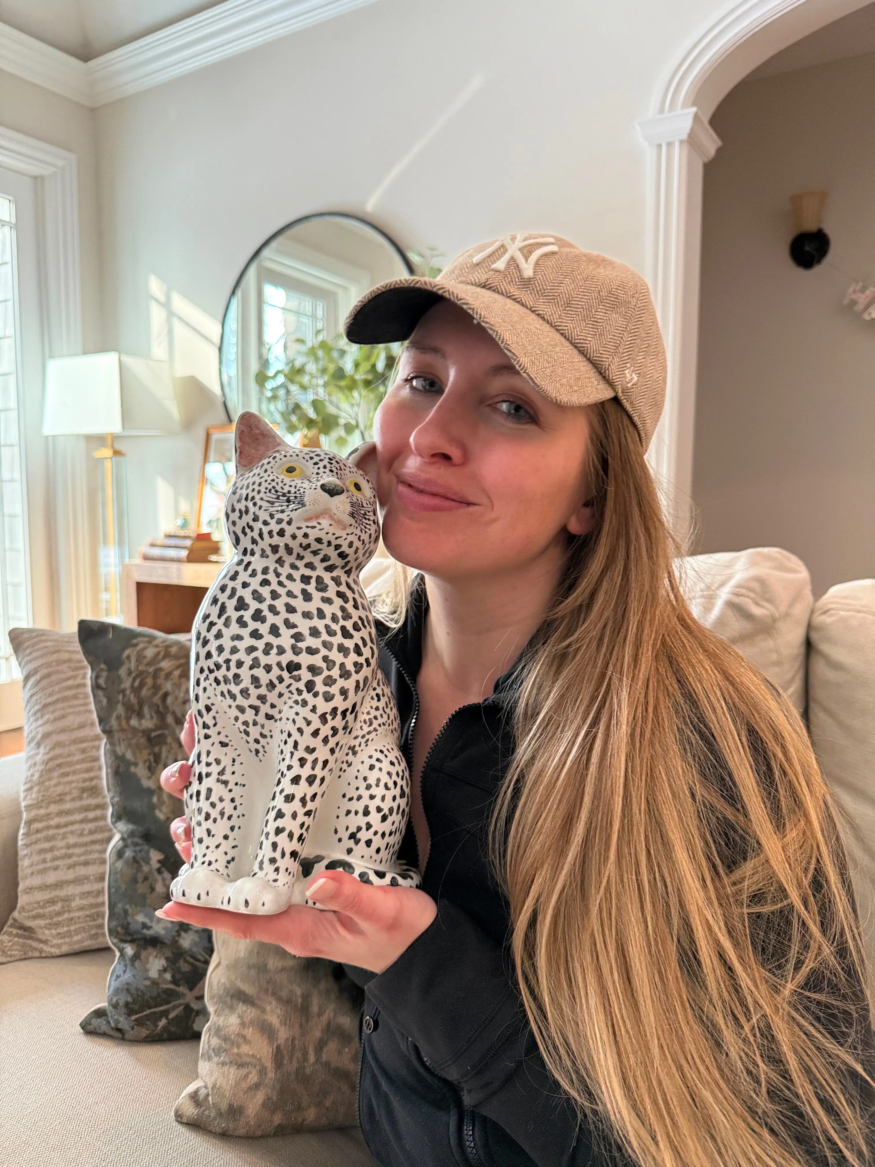 Jordan Piluso and the Fornasetti cat she bought at an estate sale.