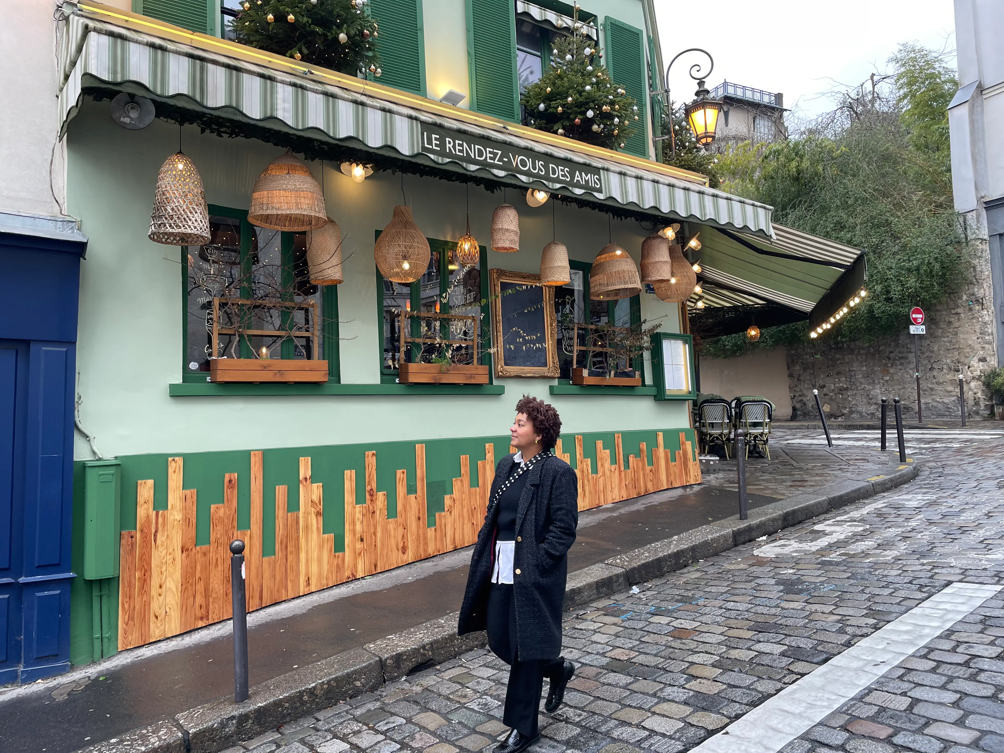 Woman walking next to building in Paris