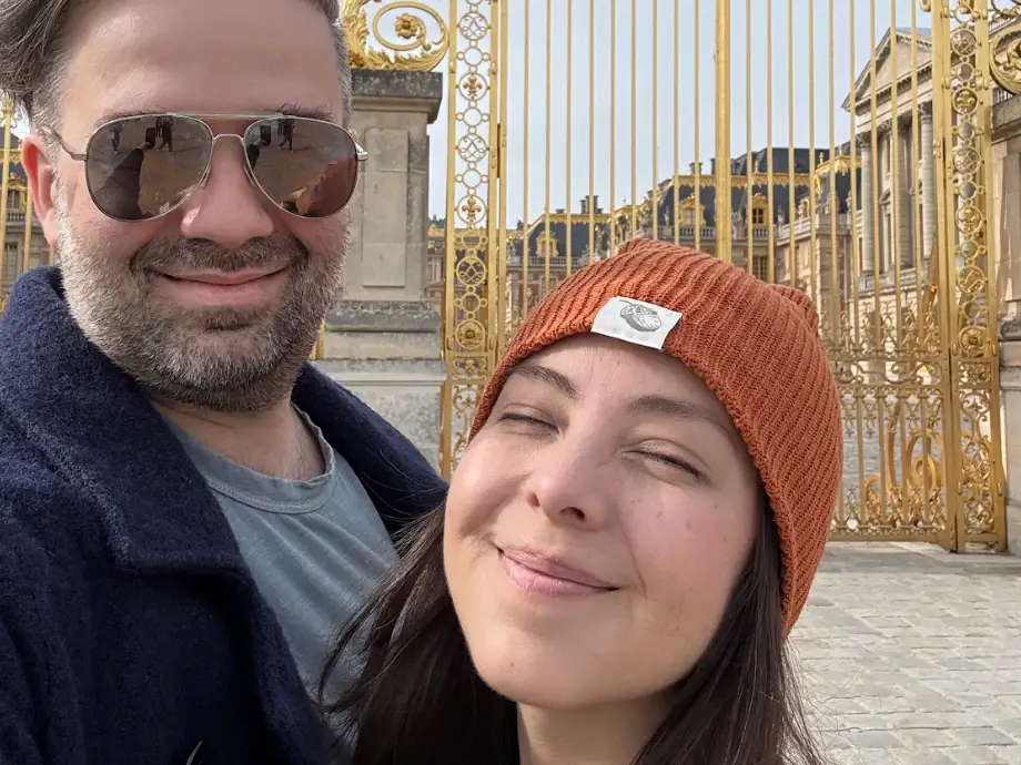 The writer and his wife posing outside in Versailles, France.