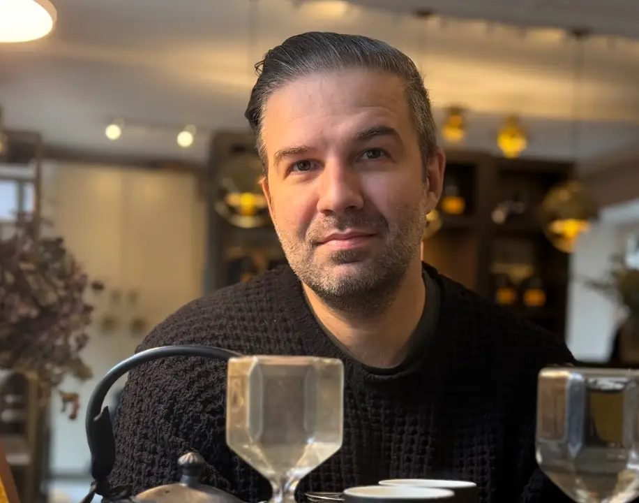 A portrait-mode image of the writer in Versailles.