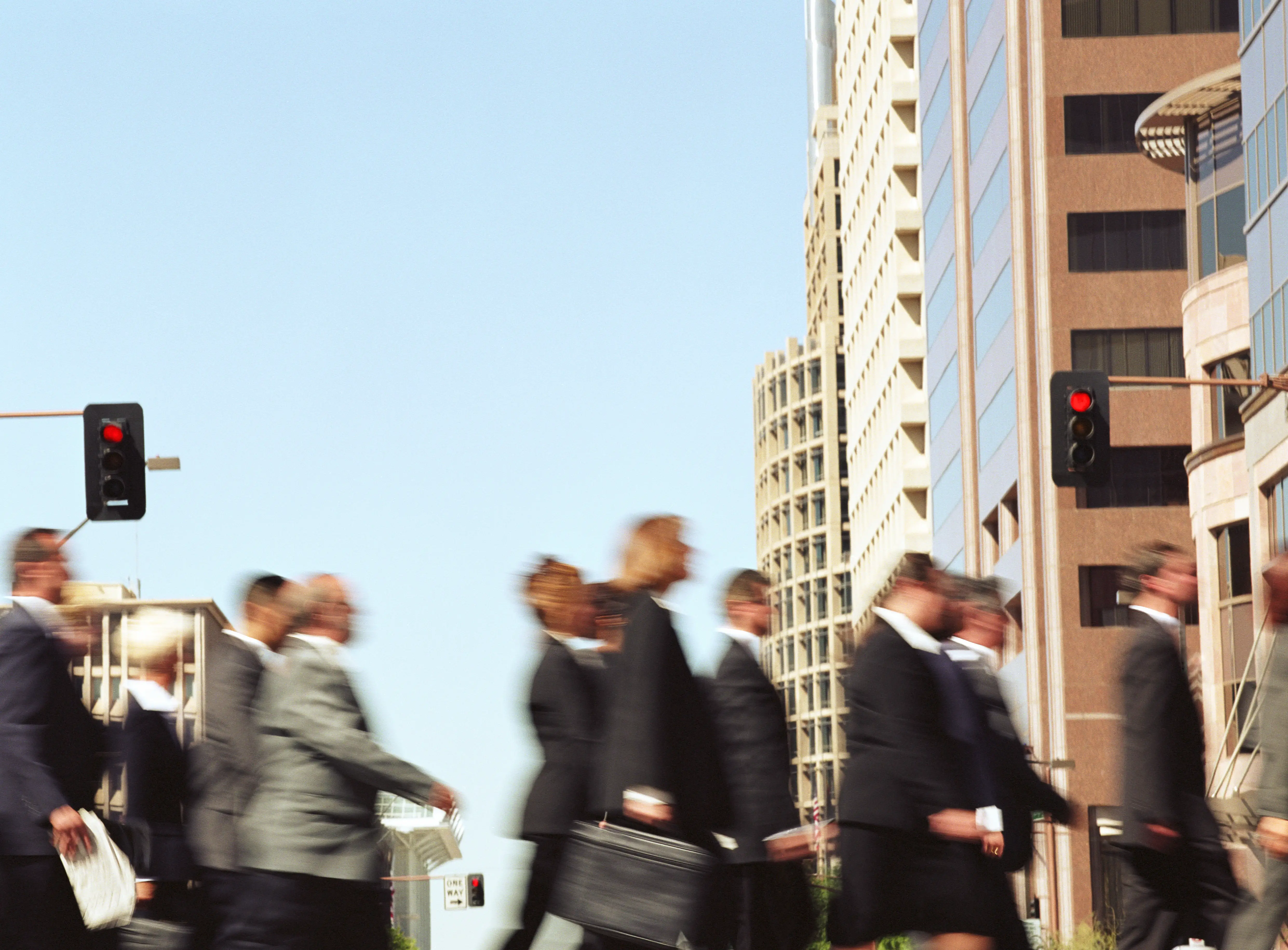 A crowd of people in the street.