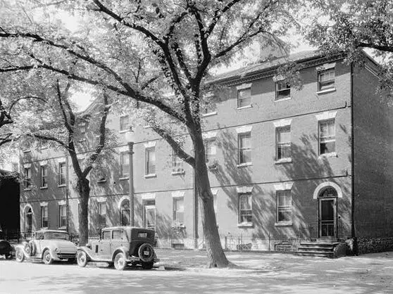 A black and white photo of the Wheat Row homes in the 1930s.