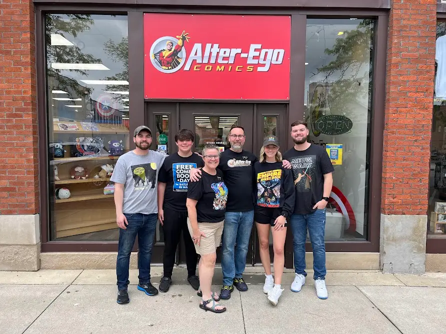 Marc Bowker and his family in front of his store, Alter Ego Comics.