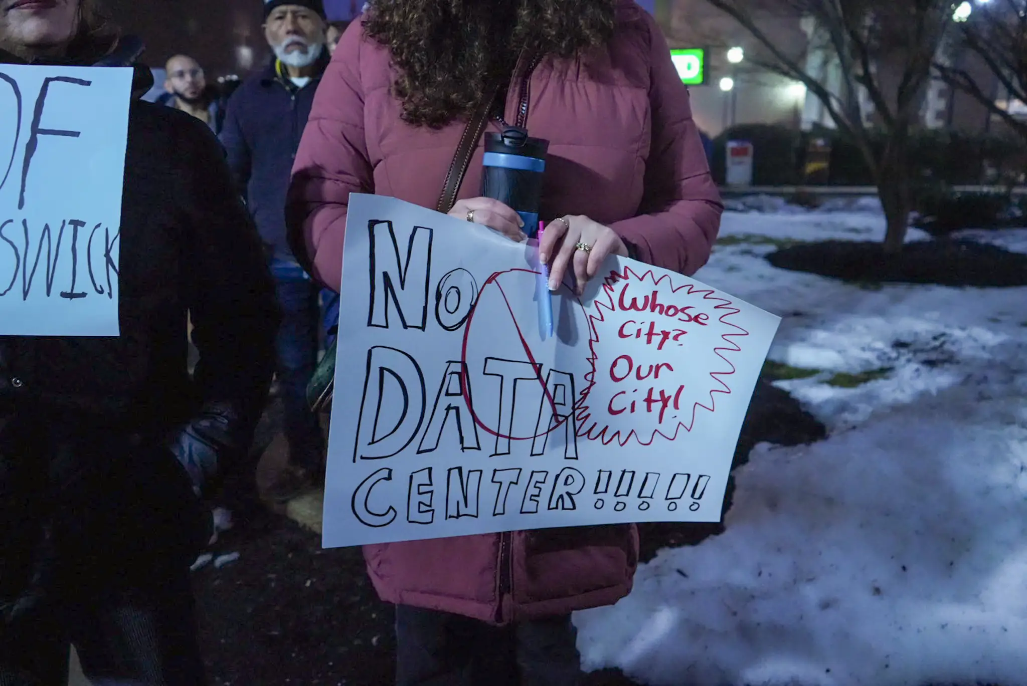 Residents protest data center in New Brunswick, New Jersey in February 2026.