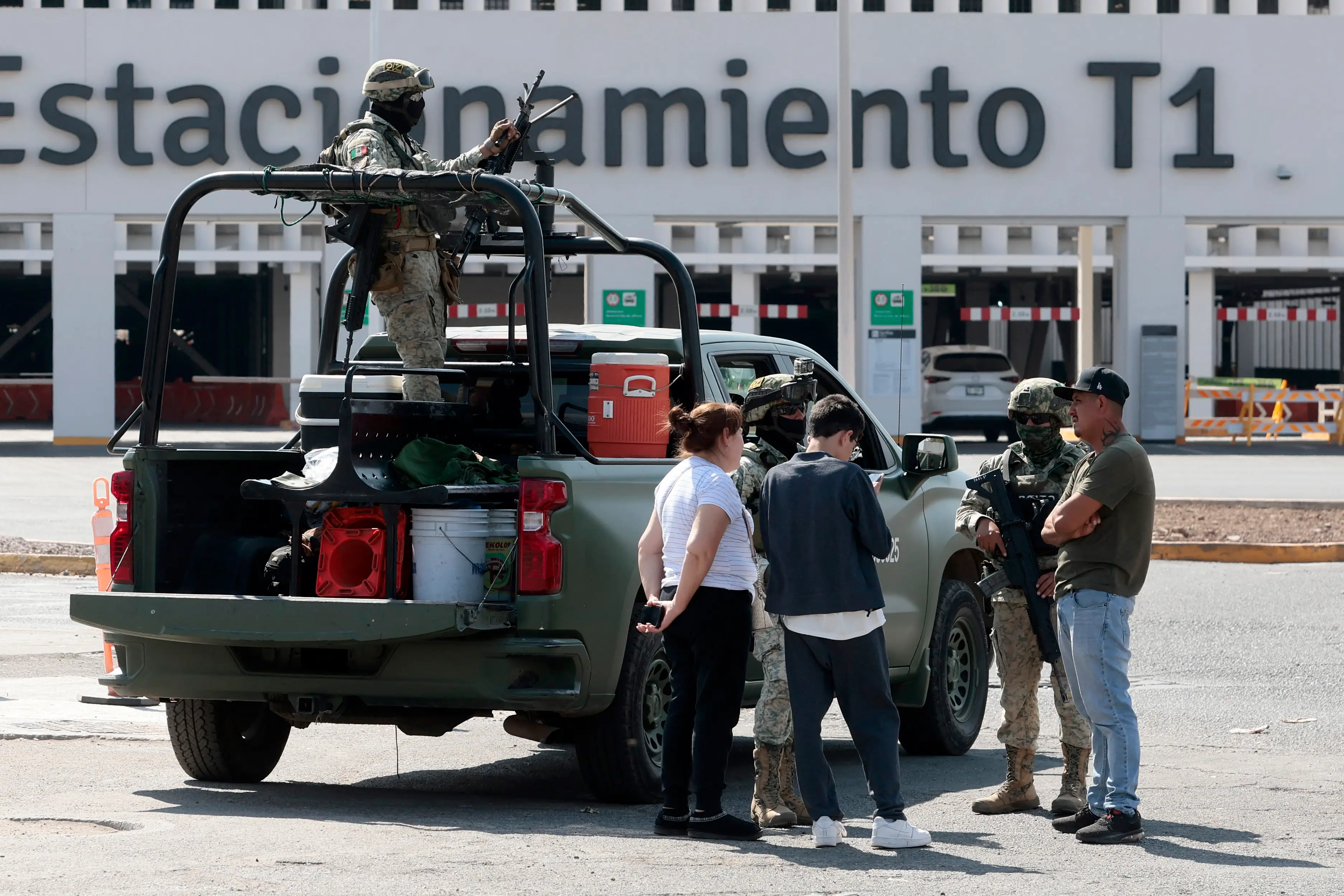 Military personnel stand on guard outside Guadalajara airport.