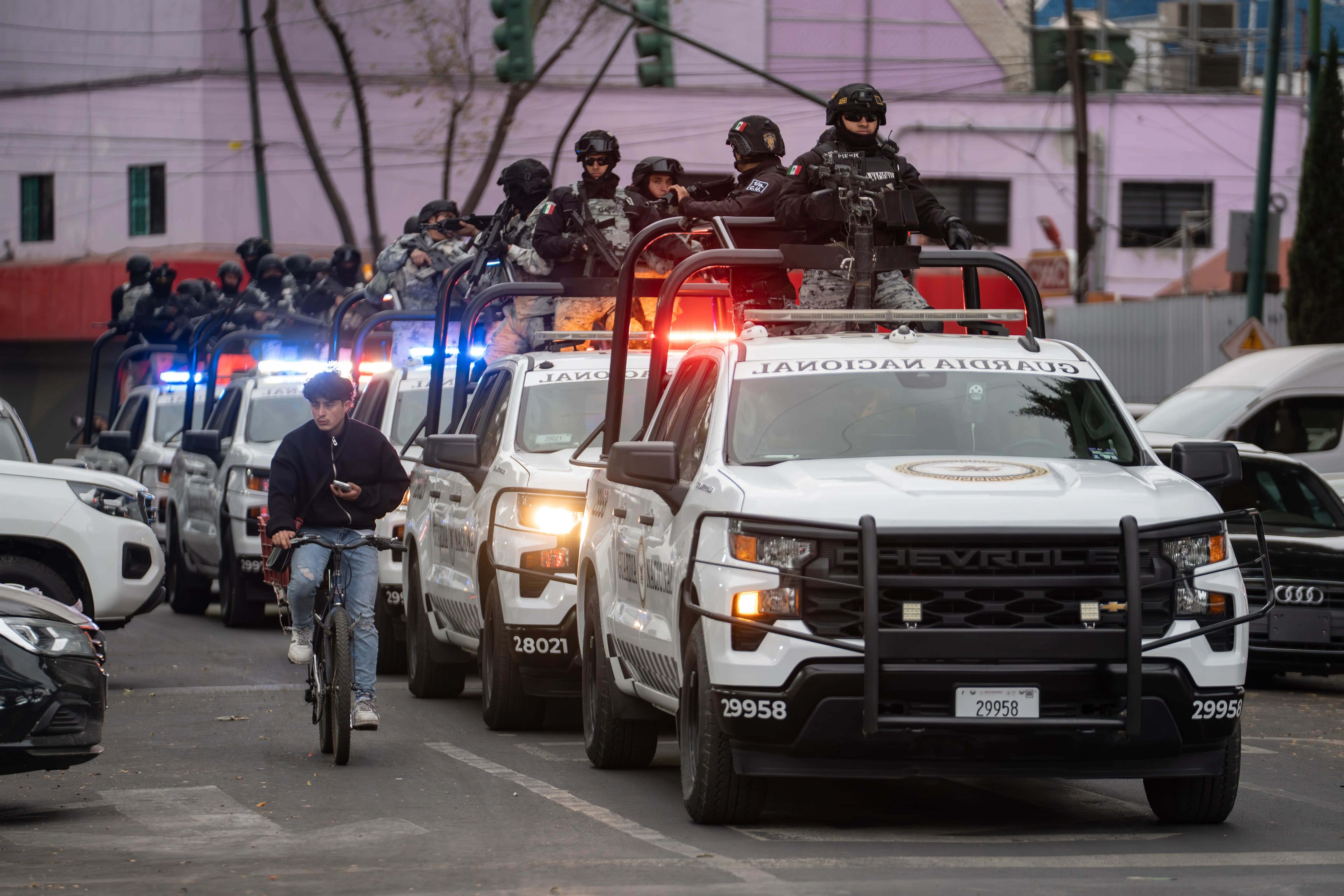 Members of the special units of the National Guard and the Secretaria de Seguridad Ciudadana stand guard in front of the Fiscalia General de la Republica, where the investigation into the operation in which Nemesio Oseguera Cervantes,