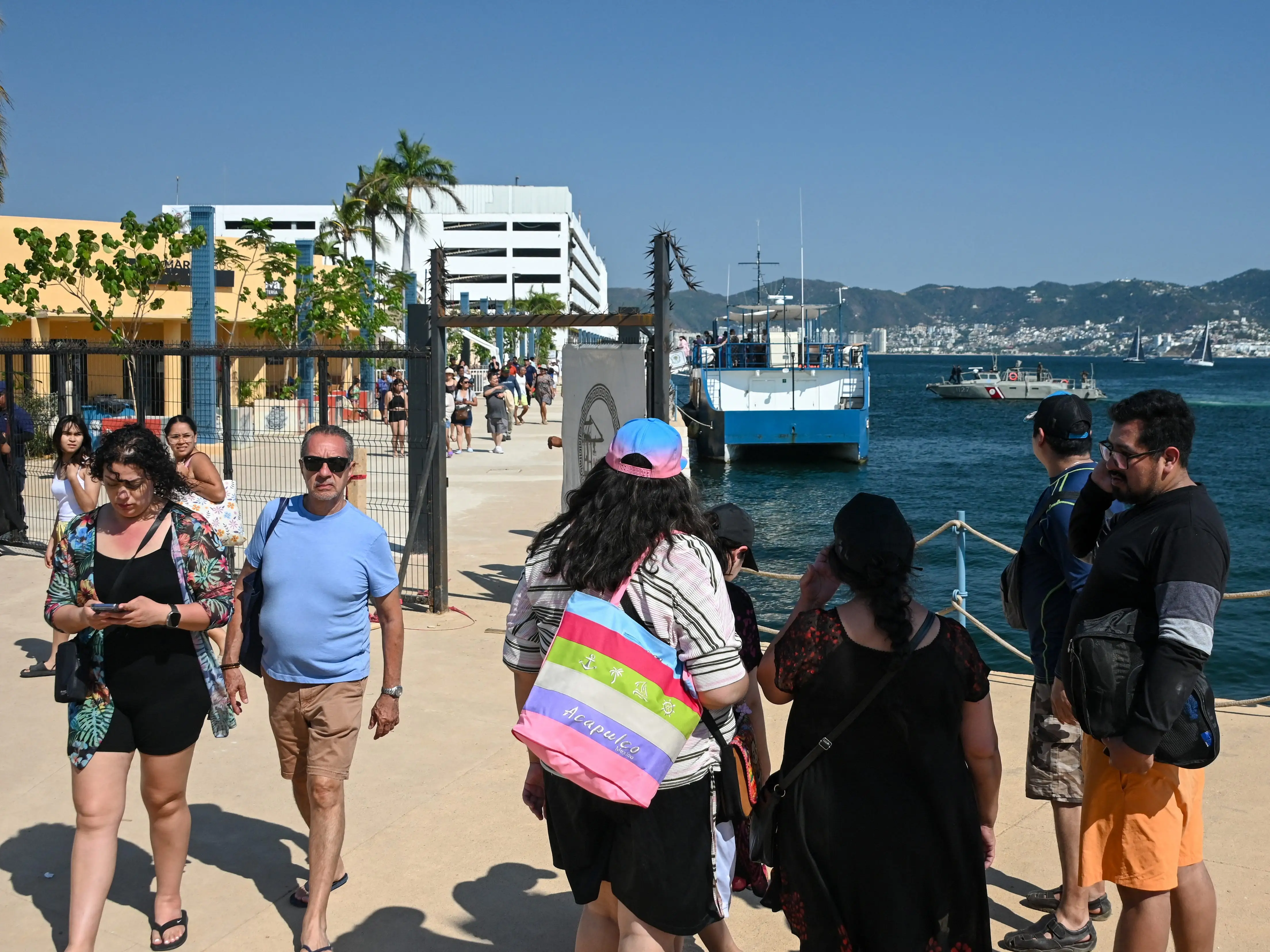 Tourists leave a port