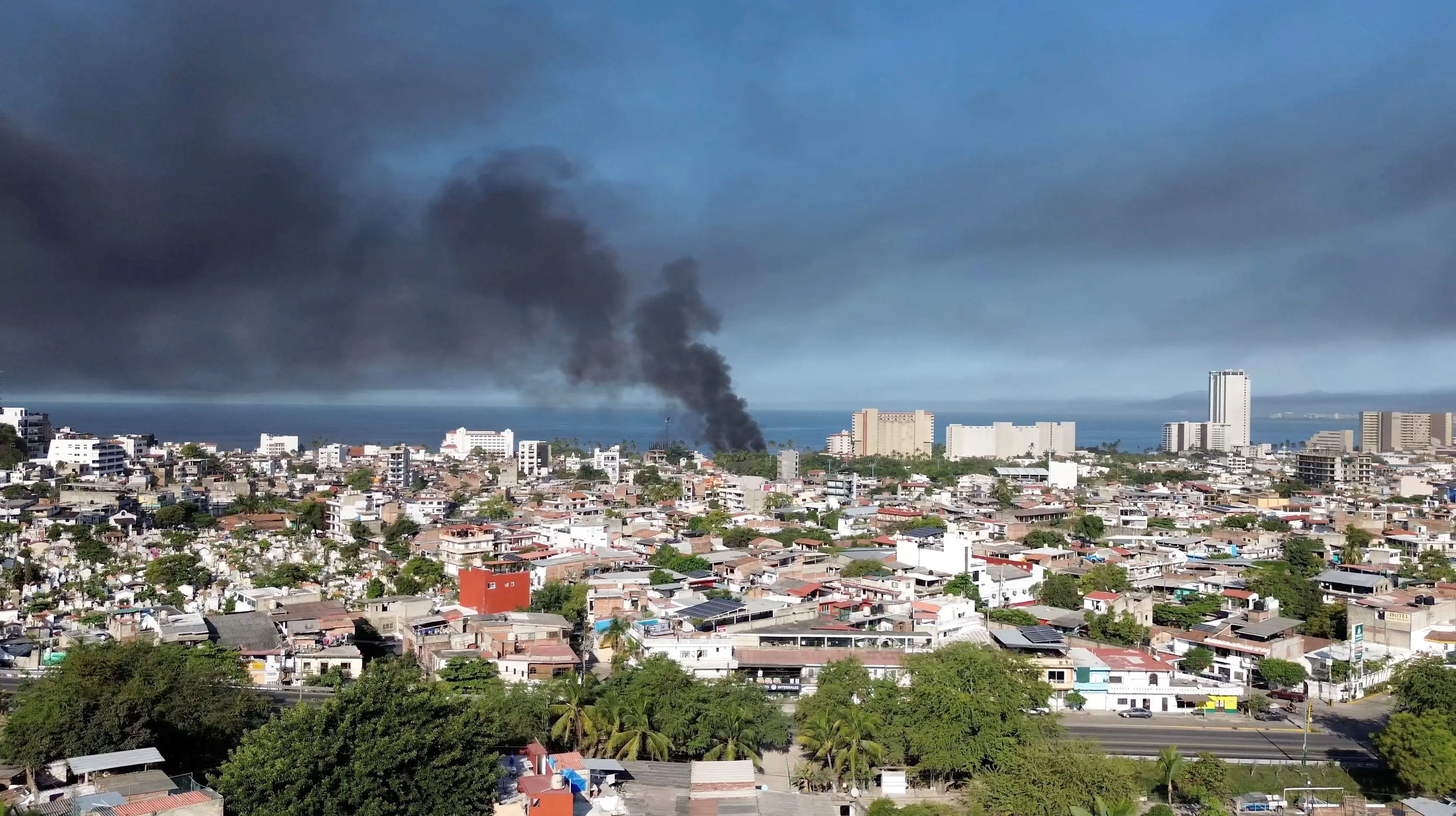A general view over Puerto Vallarta as smoke rises.