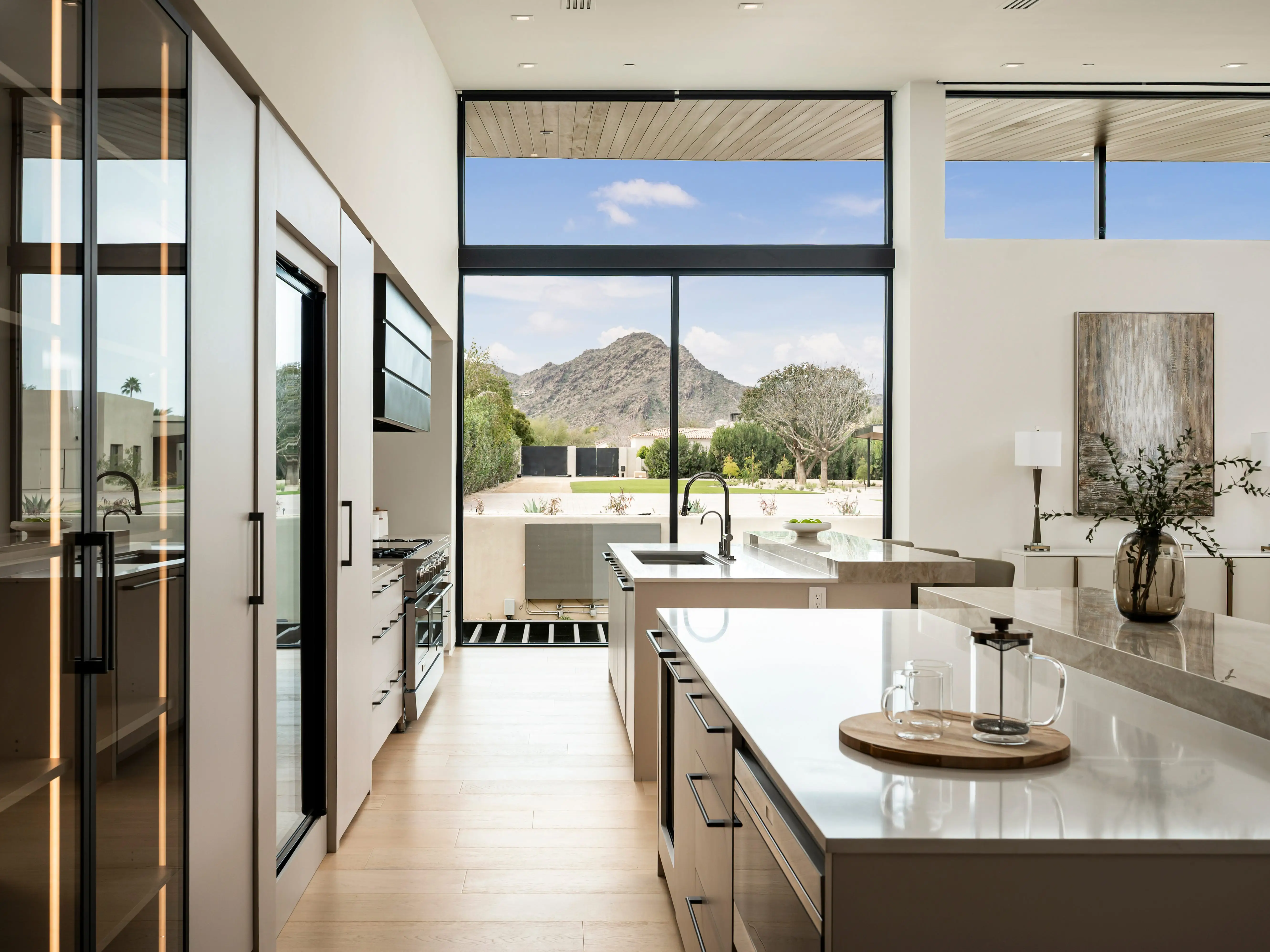 A kitchen with two island counters.