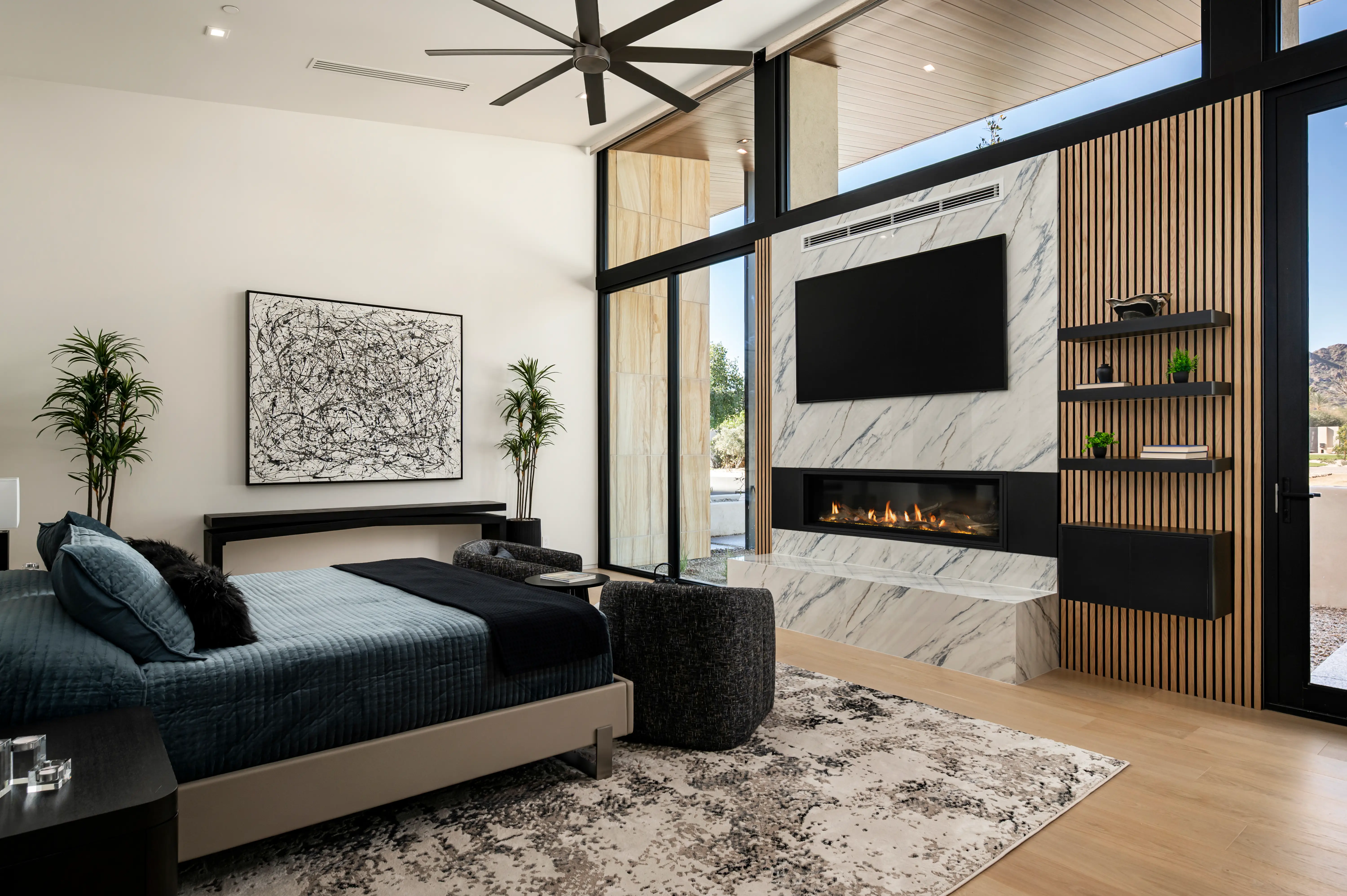 A bed in front of a fireplace.