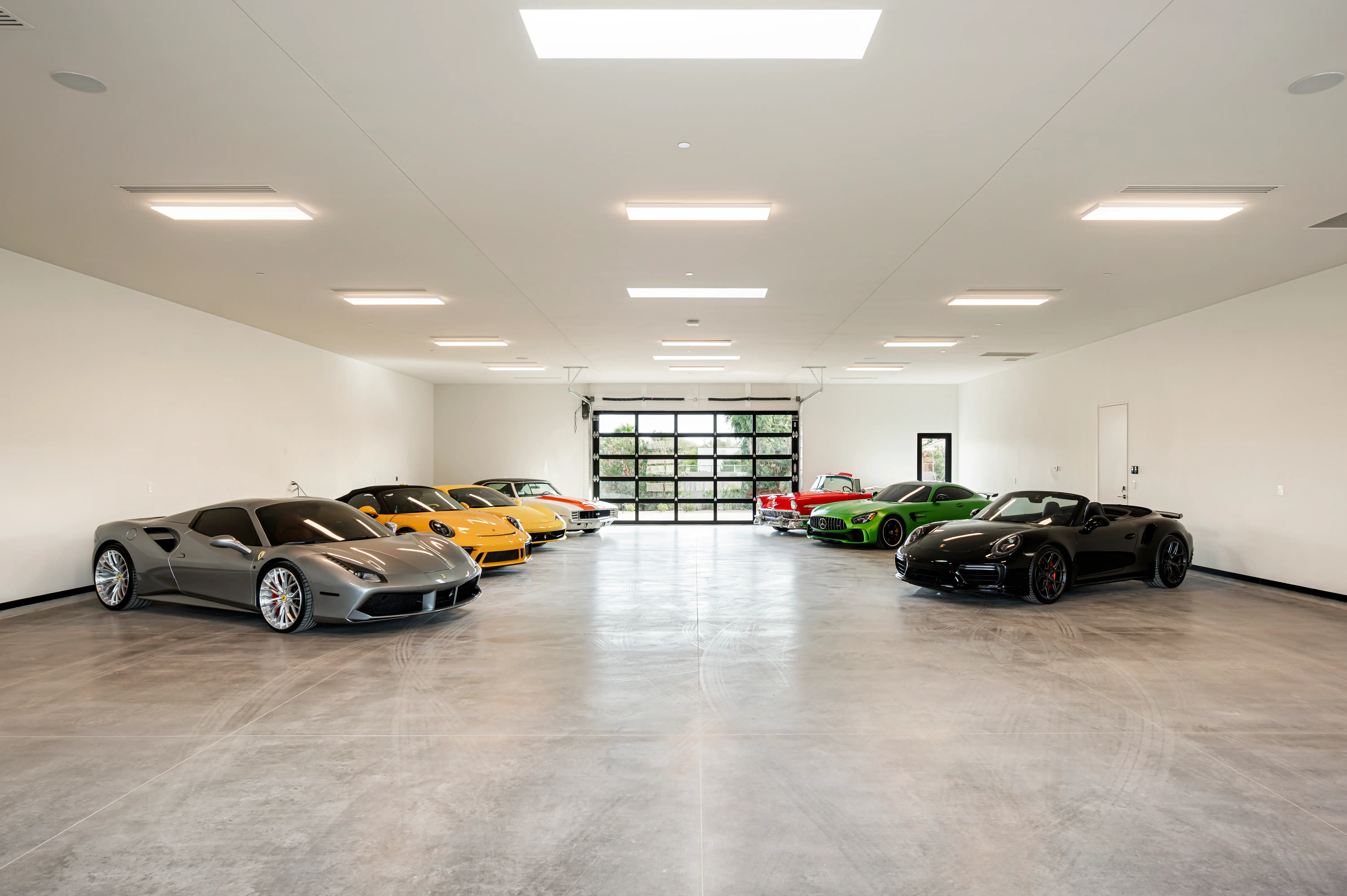 Cars lined up in a garage.