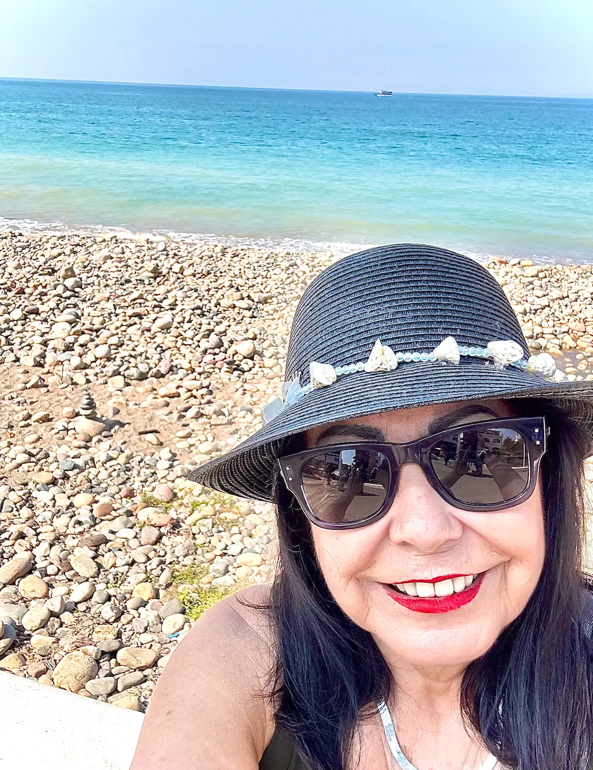 Woman posing for photo at beach