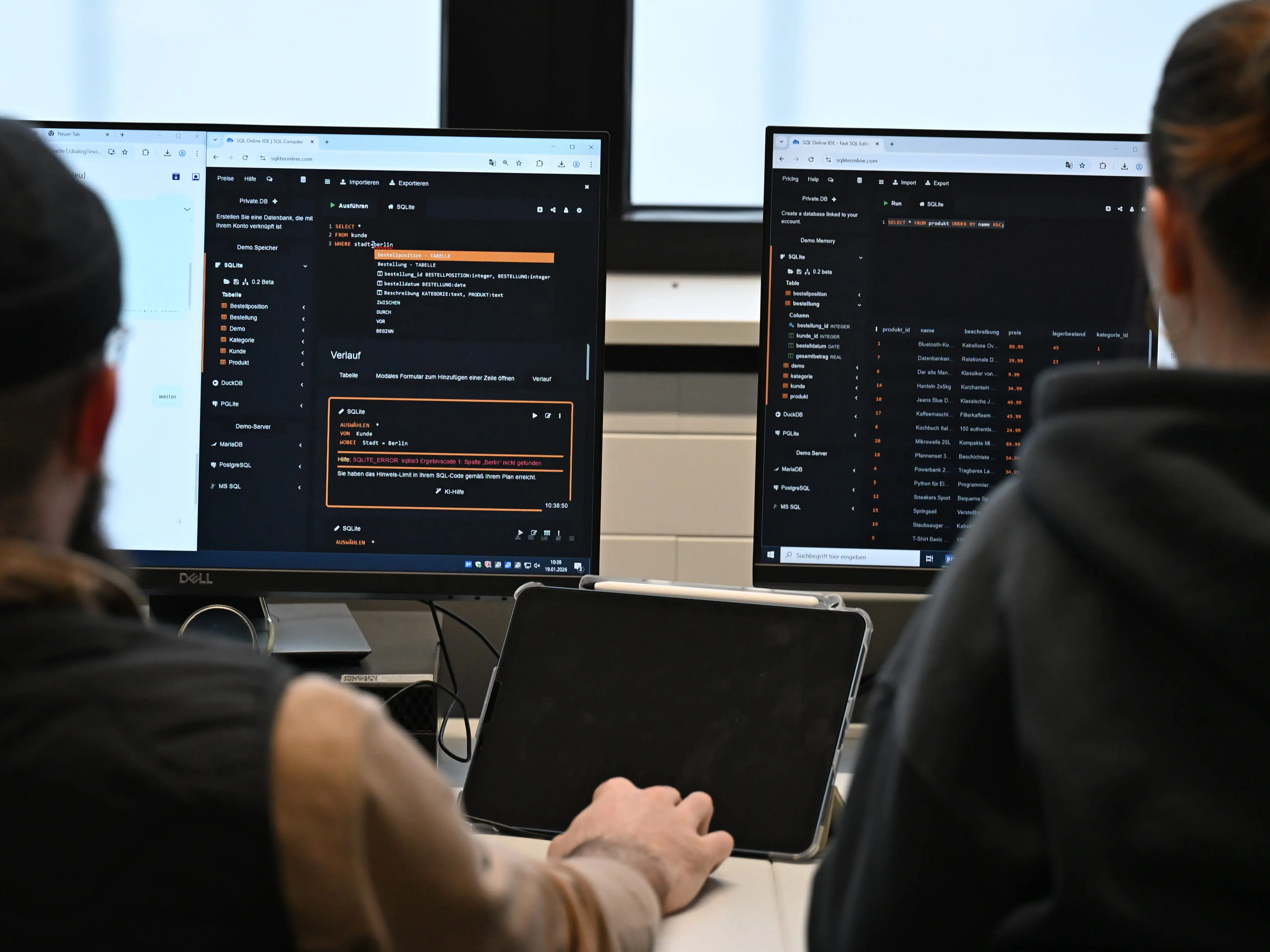 two people looking at computer screen