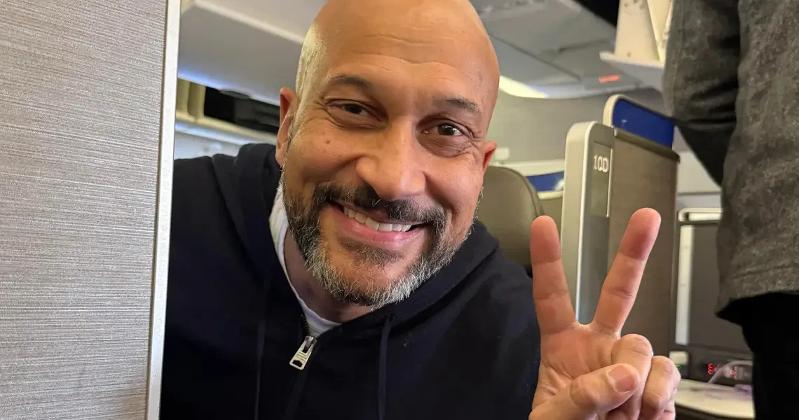 Someone asked to switch our business seats on a plane. I said yes, and got to take photos with one of my favorite celebrities.